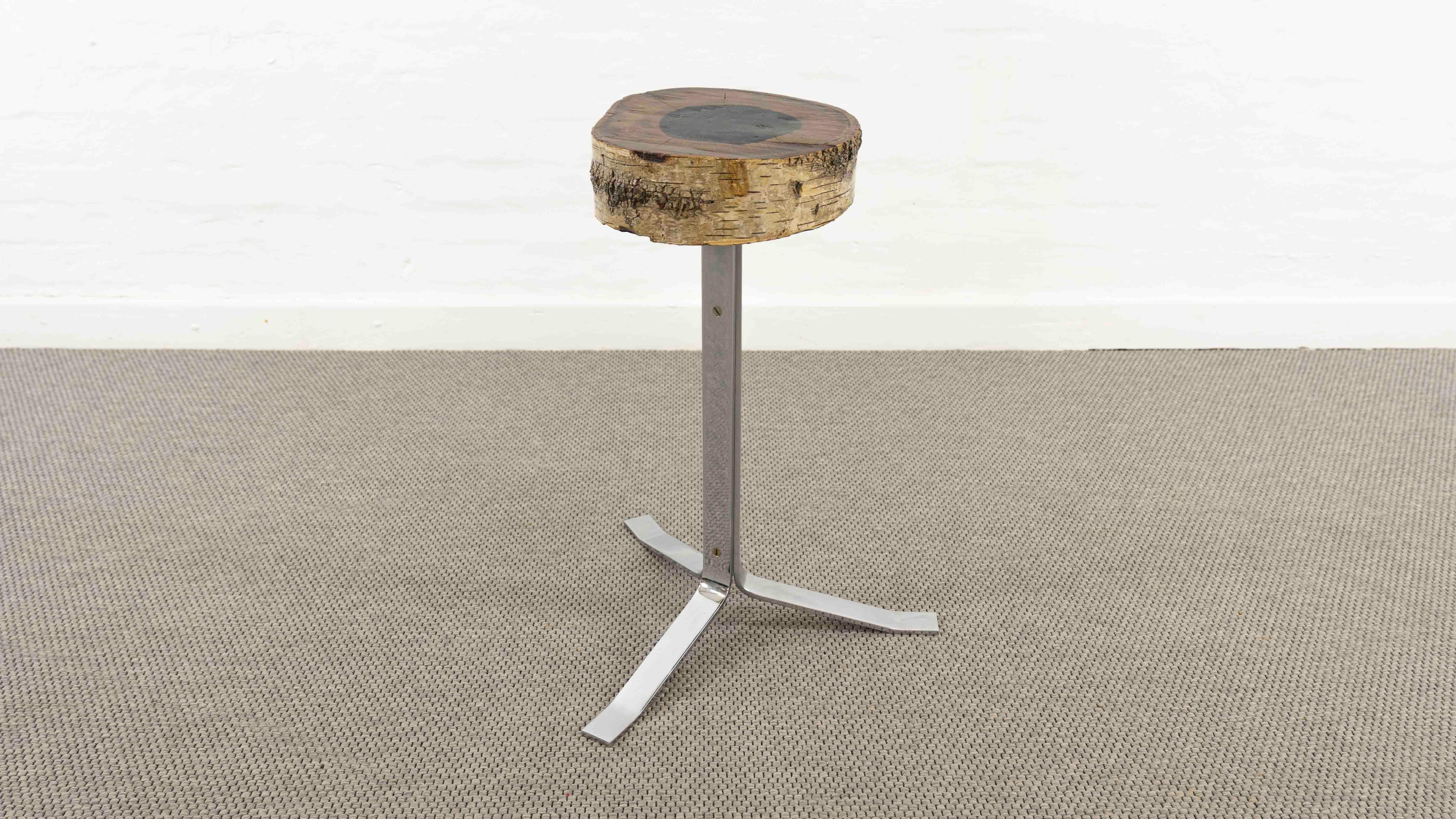 Vintage Stool or Sidetable. Made from solid Birch and chromed massive steel for the base in teh 70s. Designer and Manufacturer unknown. 
Measures: Height, 65cm, Diameter of the Birch: ca. 28cm. Diameter of the base: ca. 50cm.
