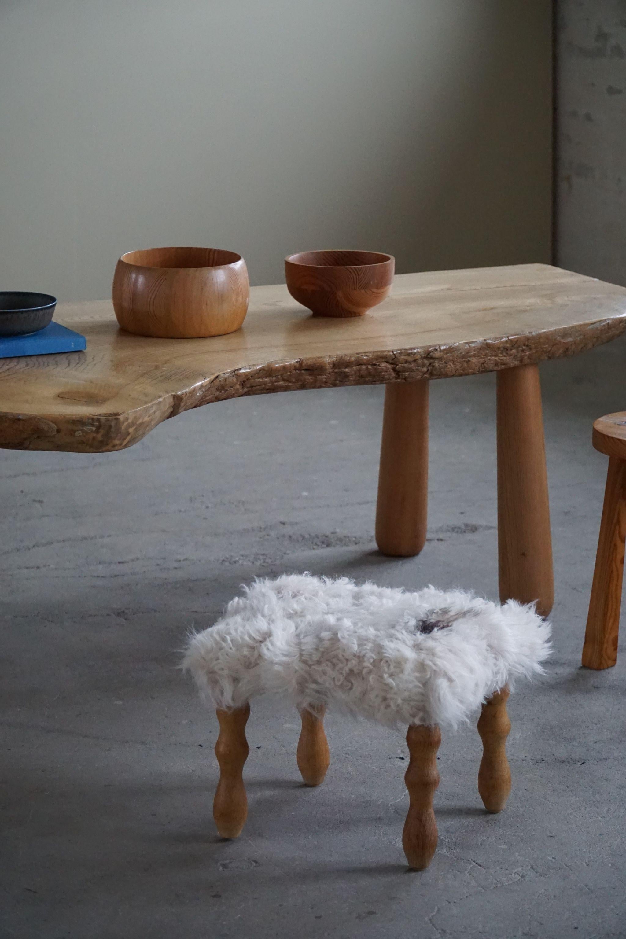 Danish modern stool in oak with curly legs, reupholstered seat long haired lambswool. Made by a Danish Cabinetmaker in ca 1950s.

A great object for the Scandinavian interior home. The overall impression is really good.

With a heavy focus on