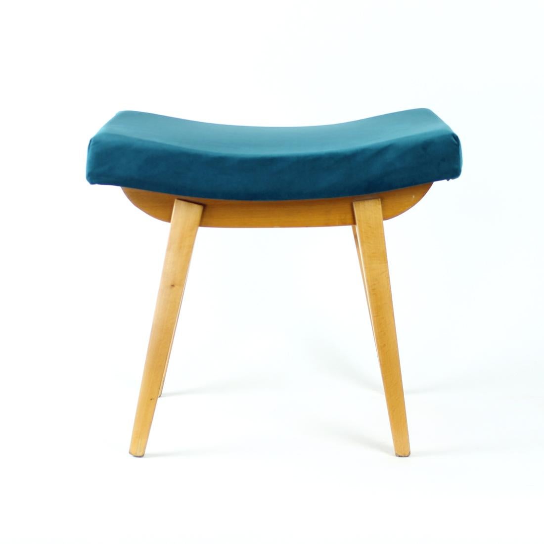 Beautiful foot stool from Mid-century modern period of Czechoslovakian design. Produced by TON company in 1960s. Made of beautiful oak wood with lovely details. Fully restored with restored wood and new upholstery. The seat is upholstered in magic