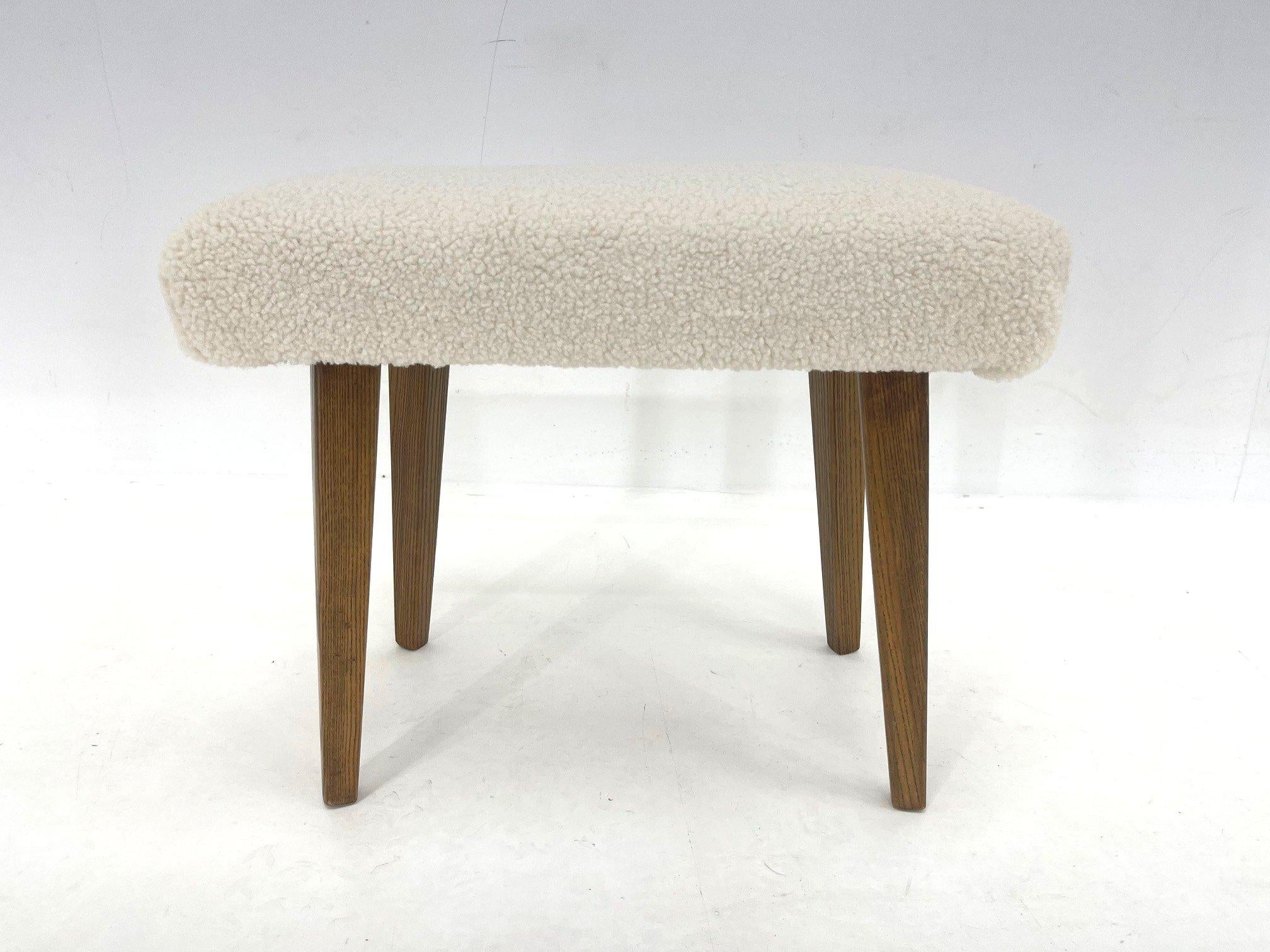Vintage stool made in former Czechoslovakia in the 1960's. Newly upholstered in sheep skin fabric. The wooden parts were carefully refurbished.