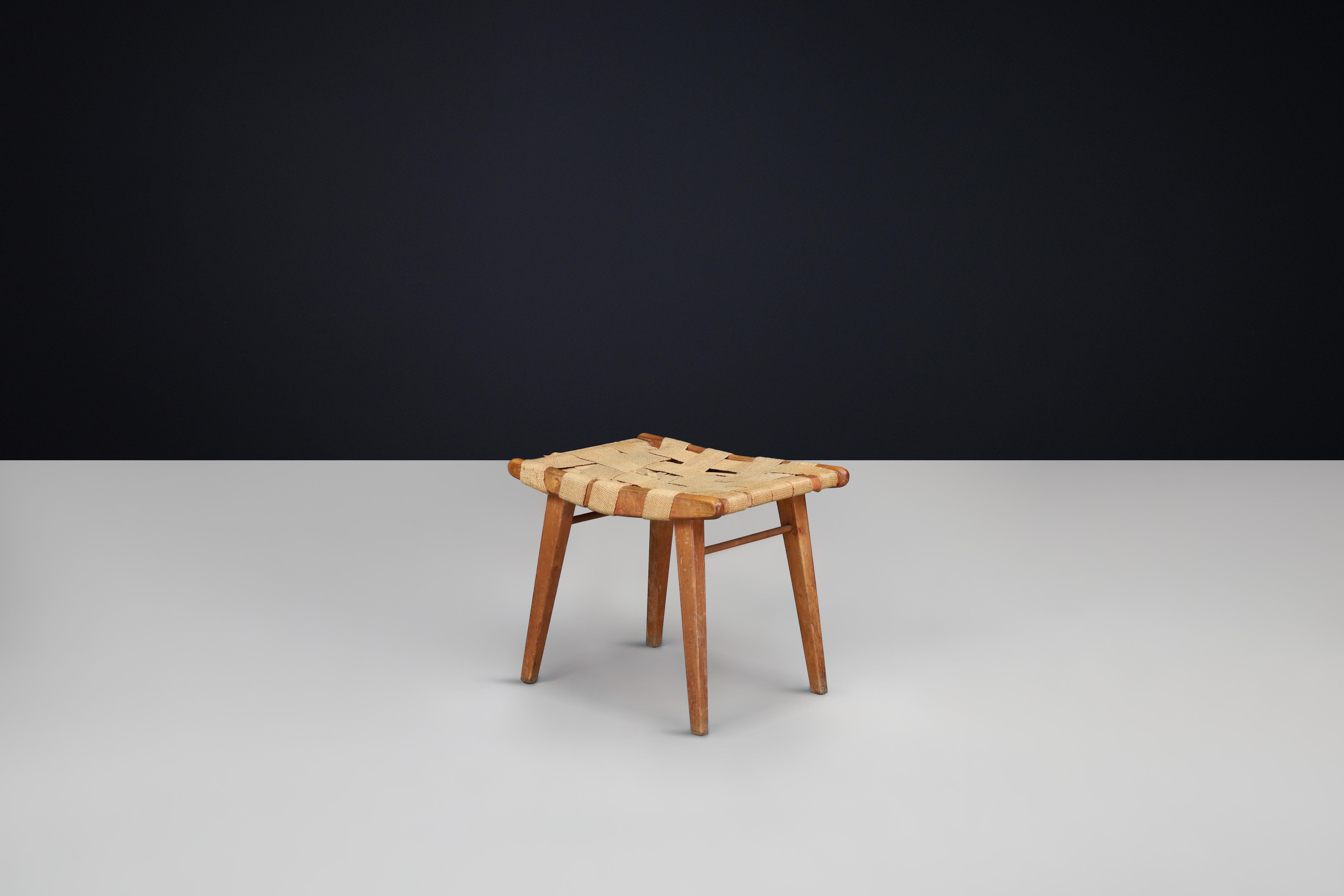 Mid-Century Stool with Woven Jute Seat and Patinated Beech Wood Frame, France, 1950s — 1 Available

A beautifully understated example of mid-century rustic design, this French stool from the 1950s features a handwoven jute seat set atop a solid