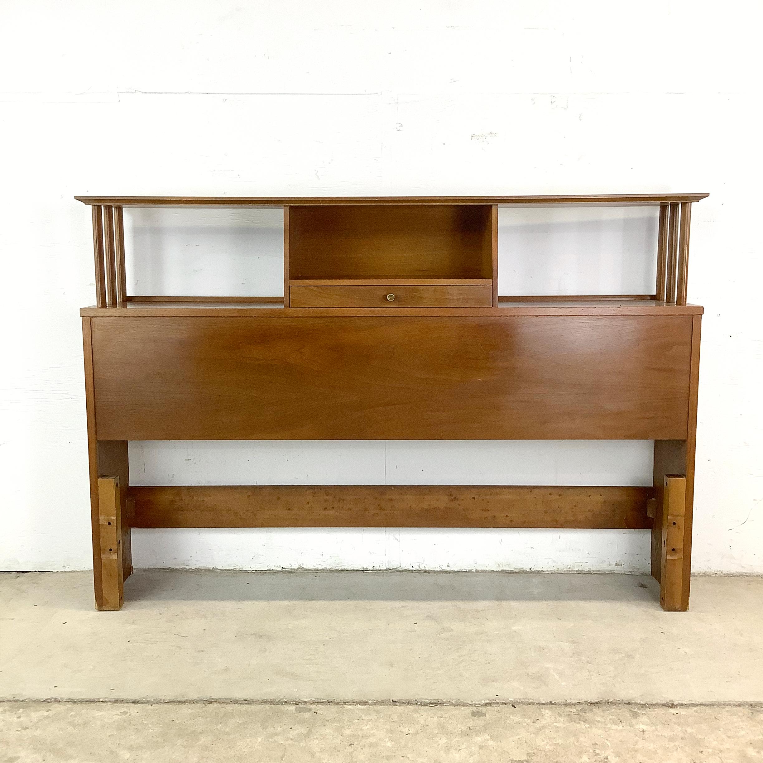For lovers of mid-century modern design, this vintage walnut storage headboard is the perfect blend of form and function. Crafted for a full-size bed, it features an open-back display shelf, sculptural lines, and a convenient center storage