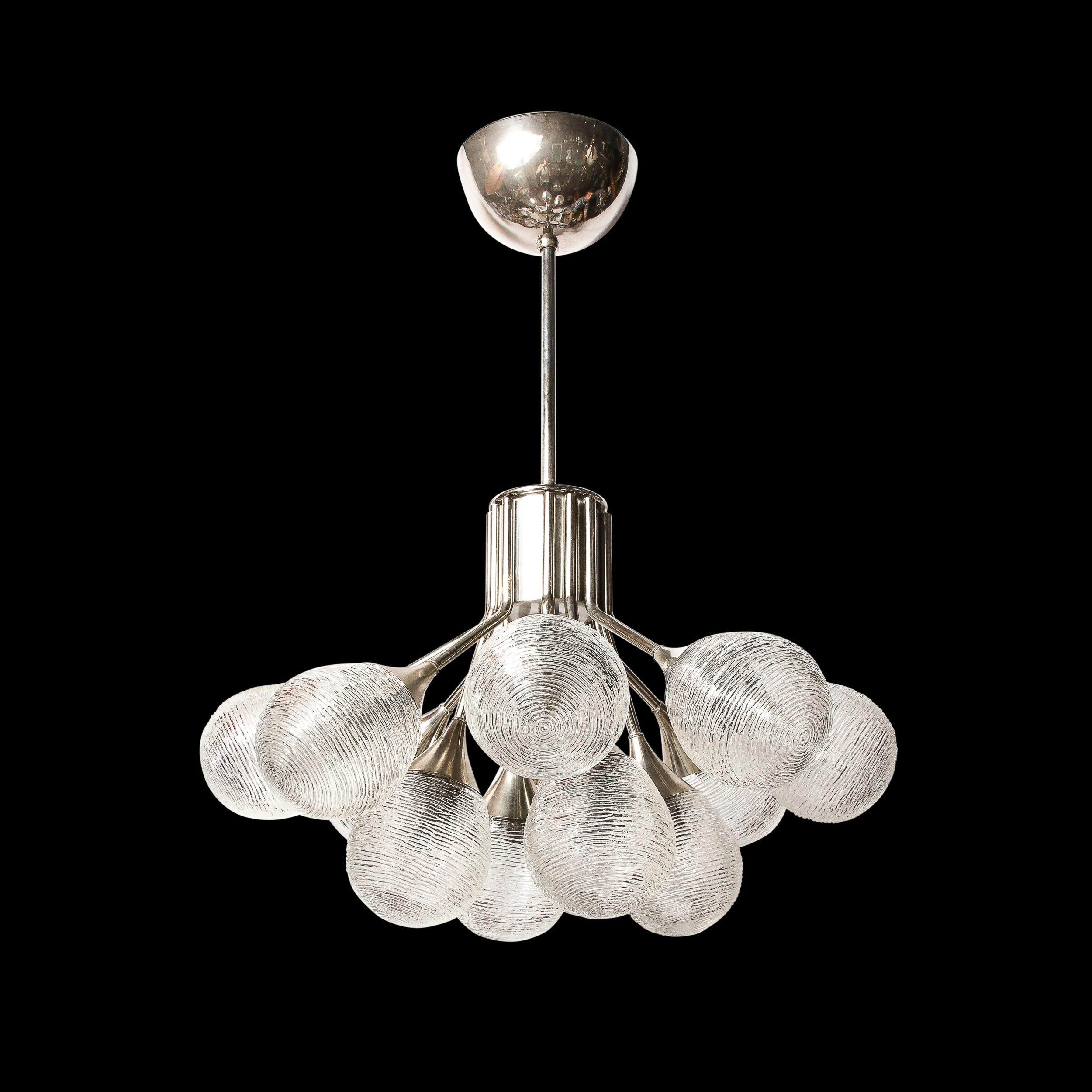-This Mid-Century Modernist Sputnik Chandelier was created by Kaiser Leuchten and originates from Germany, Circa 1970. Featuring a unique downward facing sputnik form frame in chrome with a central joining cylinder in brushed Aluminum, this piece