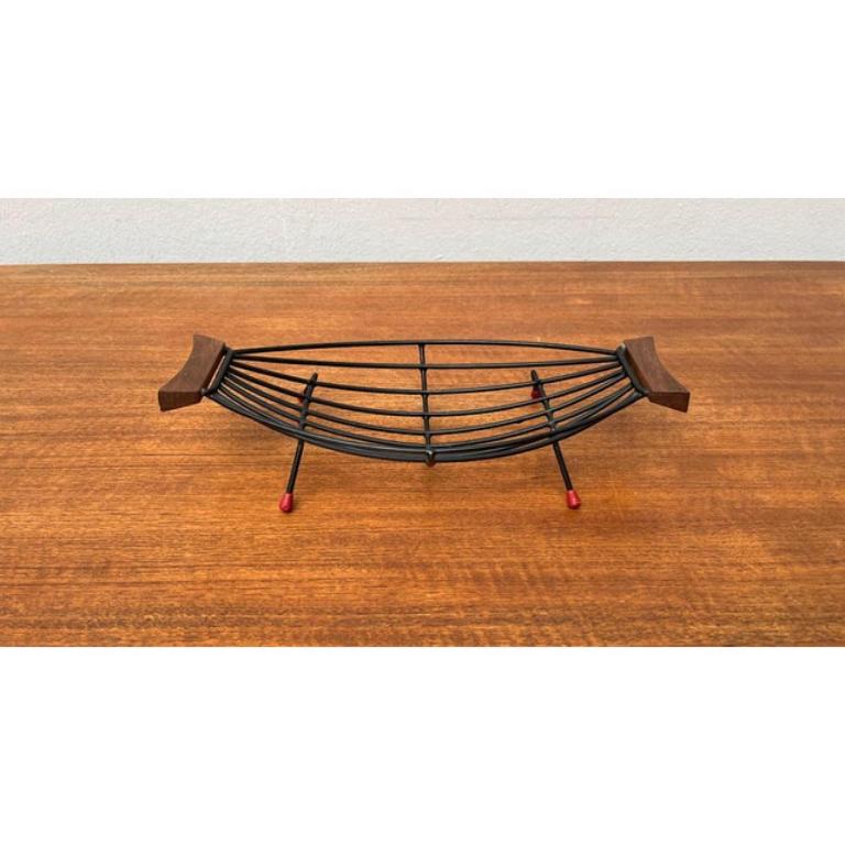 Mid-Century String Fruit Bowl with Teak Handle, 1960s, in Very Good conditions. Designed 1960 to 1969.

Additional information:
Materials: Metal, Plastic
Color: Black
Styles: Mid-Century Modern
Item Type: Vintage, Antique or Pre-owned
Dimensions: