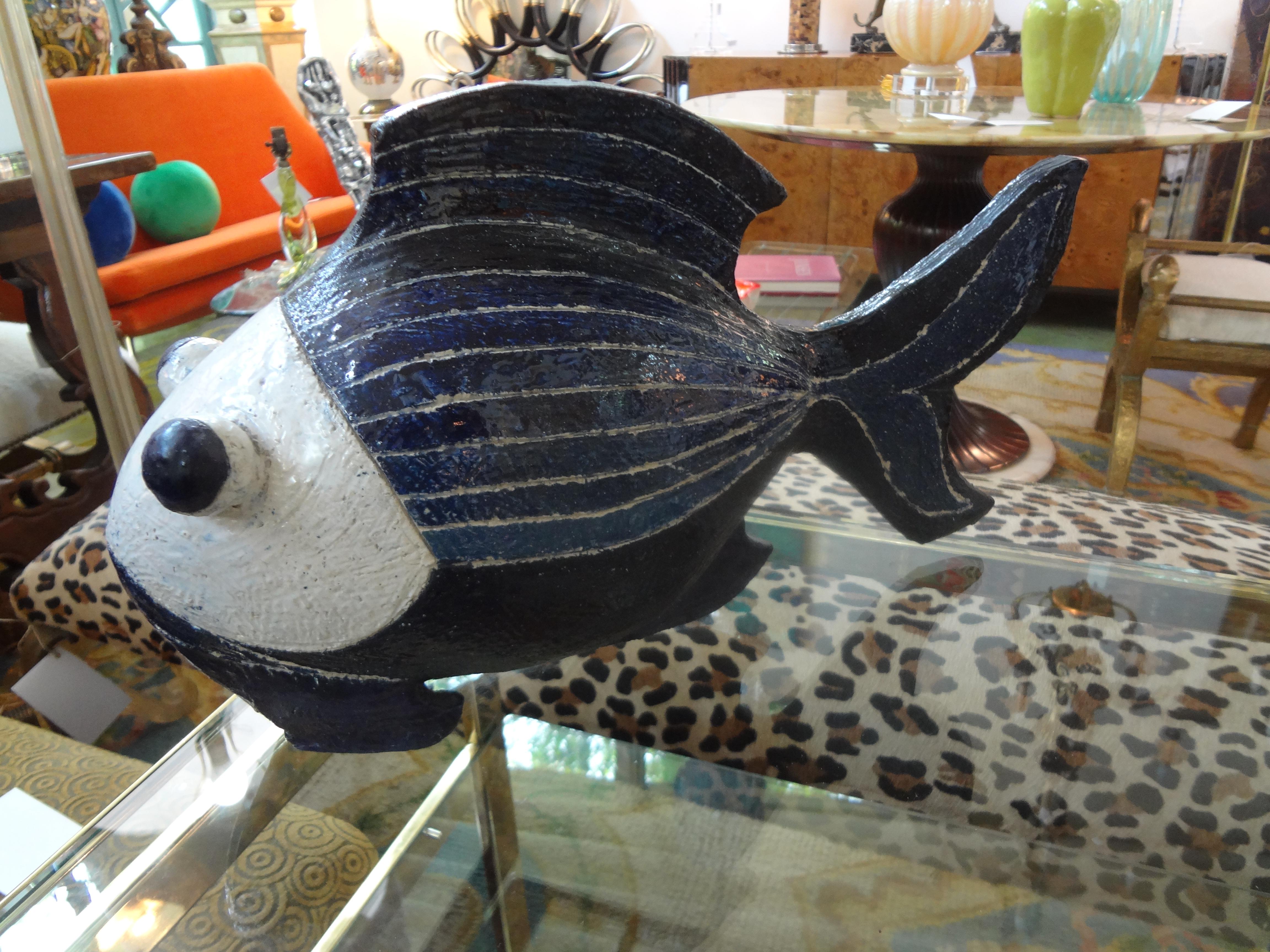 Midcentury studio art pottery fish sculpture.
Beautifully executed vintage studio art pottery fish sculpture. This large Hollywood Regency fish sculpture is executed in two beautiful shades of blue and white.