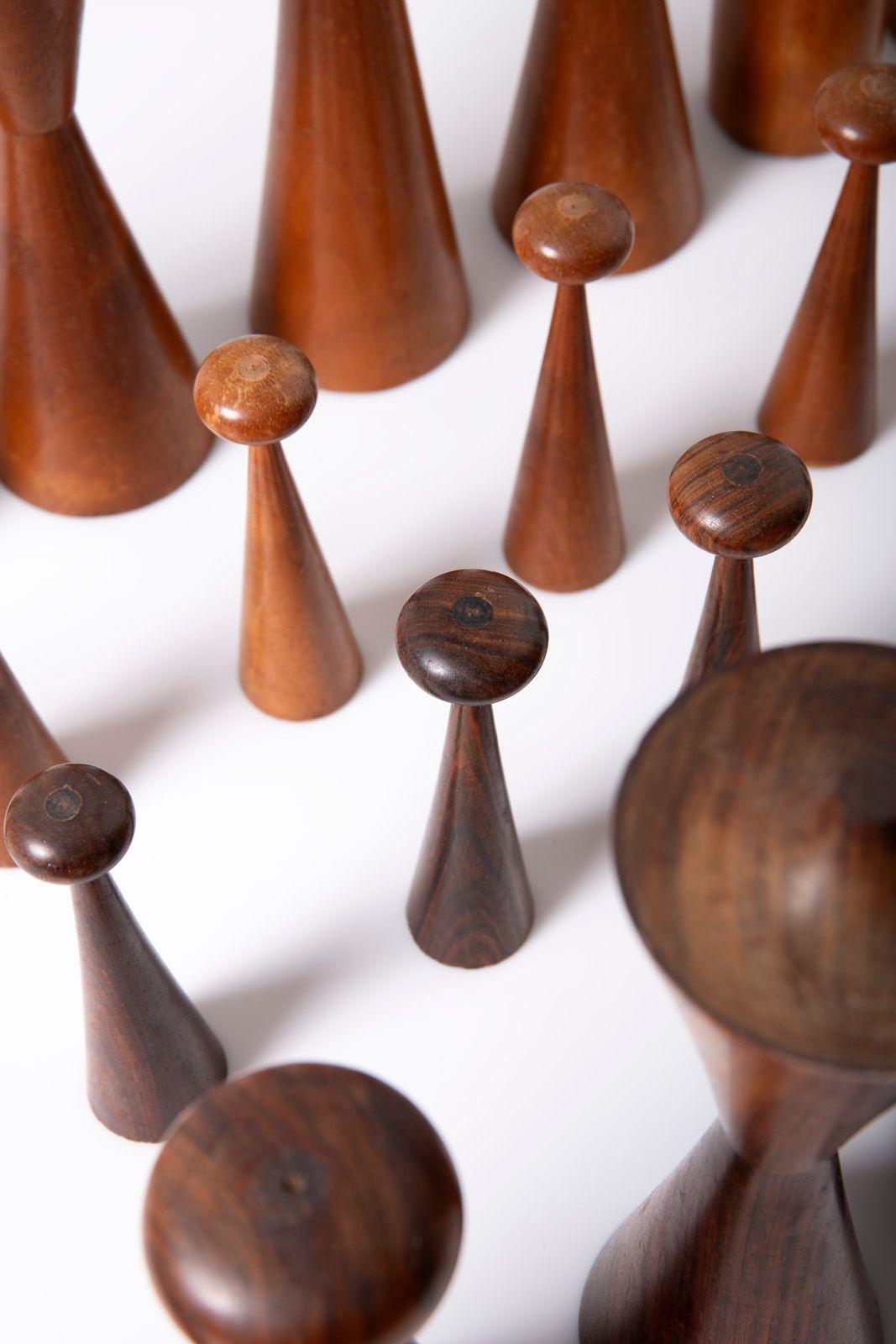 This striking hand-turned chess set, crafted in the 1960s by an unknown artisan, embodies the refined geometry and natural elegance of mid-century studio craft design. Meticulously shaped from richly figured Brazilian rosewood and warm Philippine