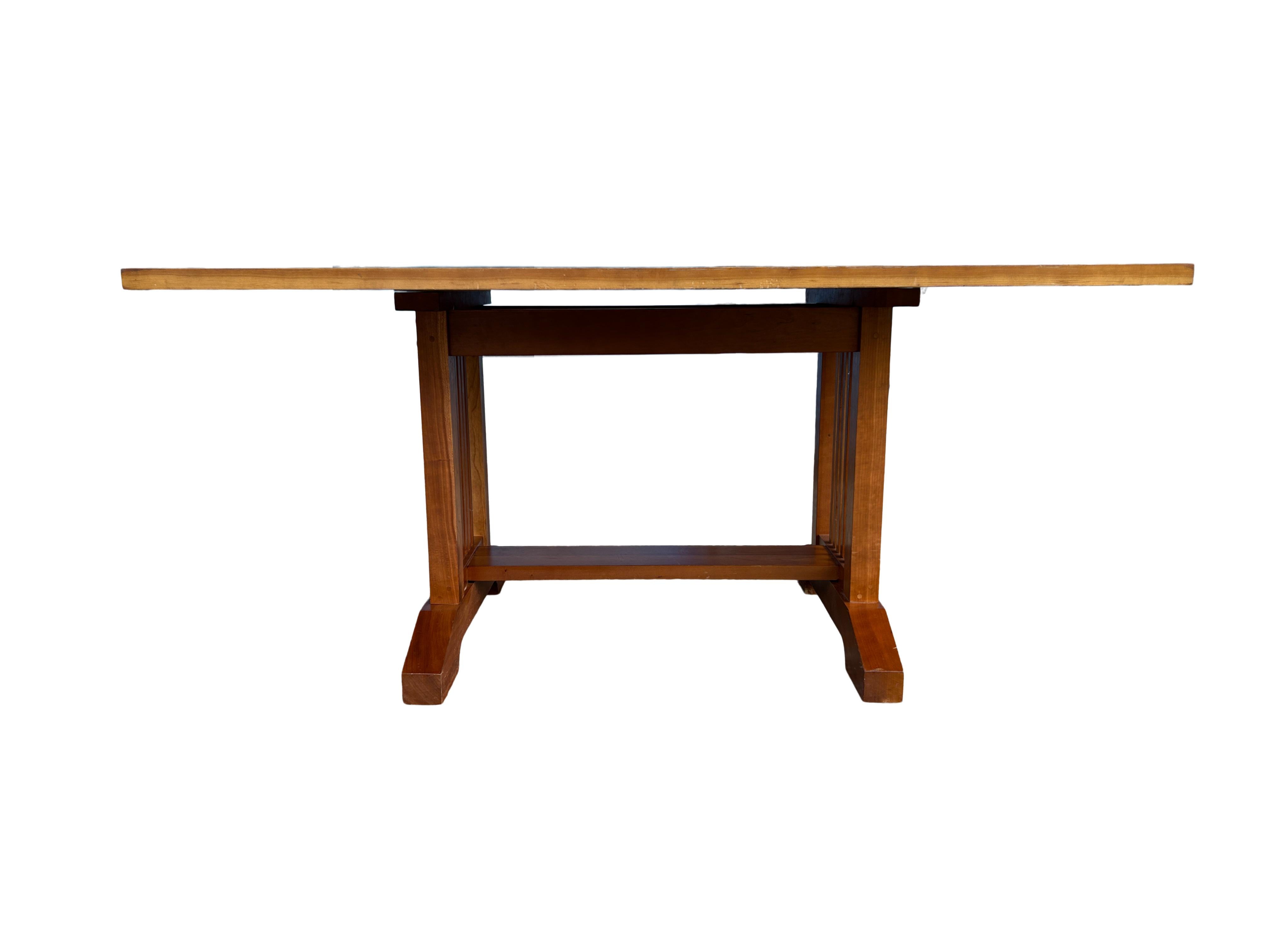 Studio craft rectangle solid cherry dining table made in USA. All handcrafted dining table. Beautiful solid cherry Mission style base Style of Frank Lloyd Wright. The table top measures 1.250