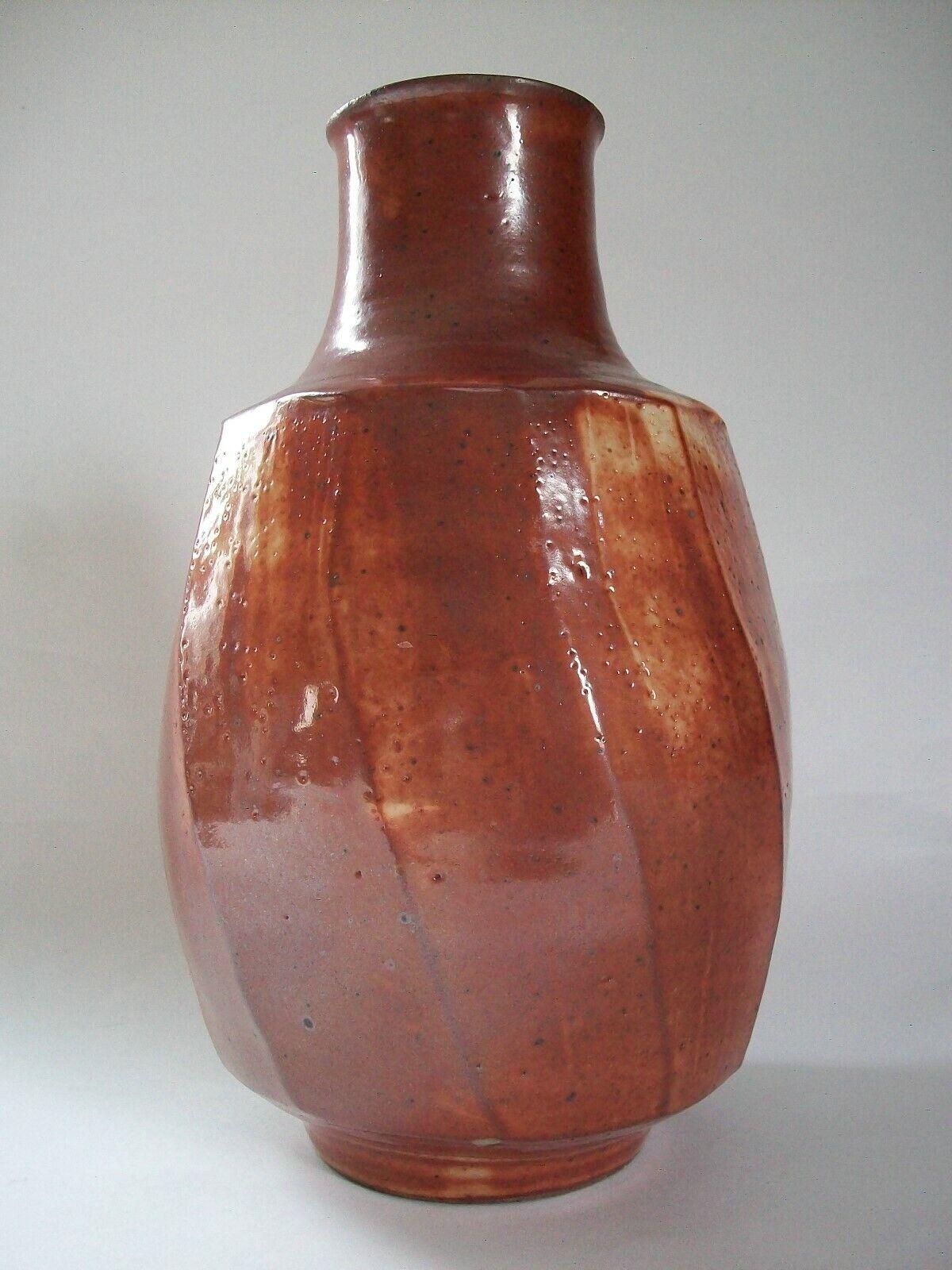 Mid Century studio pottery stoneware bottle vase with cut sides - rich red glaze over a cream base - maker's mark stamp to the base rim (unknown/unidentified potter) - country of origin unknown - circa 1970's.

Excellent vintage condition - minor