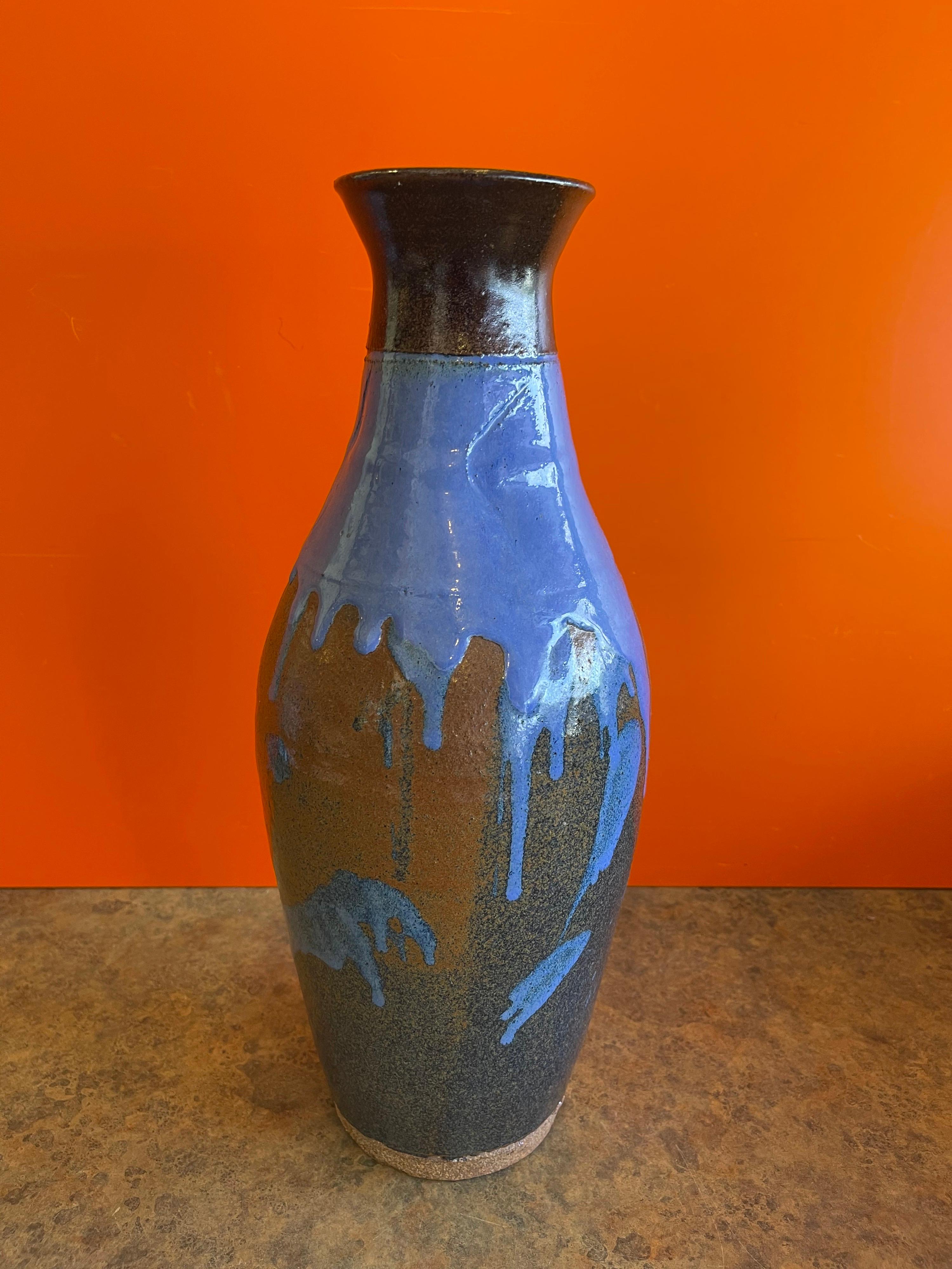 Mid-century studio pottery vase with blue drip glaze, circa 1980s. The vase is in very good vintage with no chips or cracks and measures 6.5