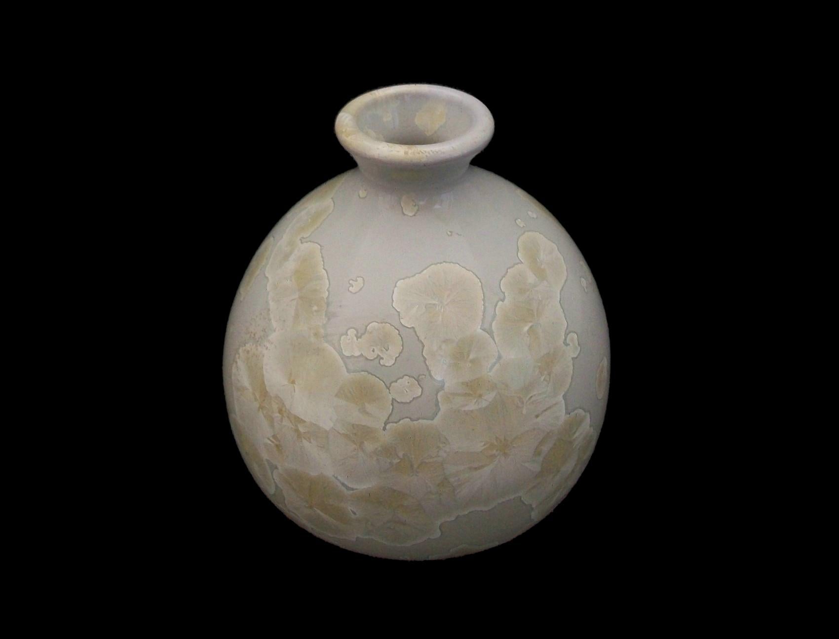 Midcentury studio pottery vase with crystalline glaze - hand made featuring a wheel thrown white clay body with artistic distribution of crystal formations within the beige glaze - unglazed base - signed on the base (Woodhill) - Canada (likely) -