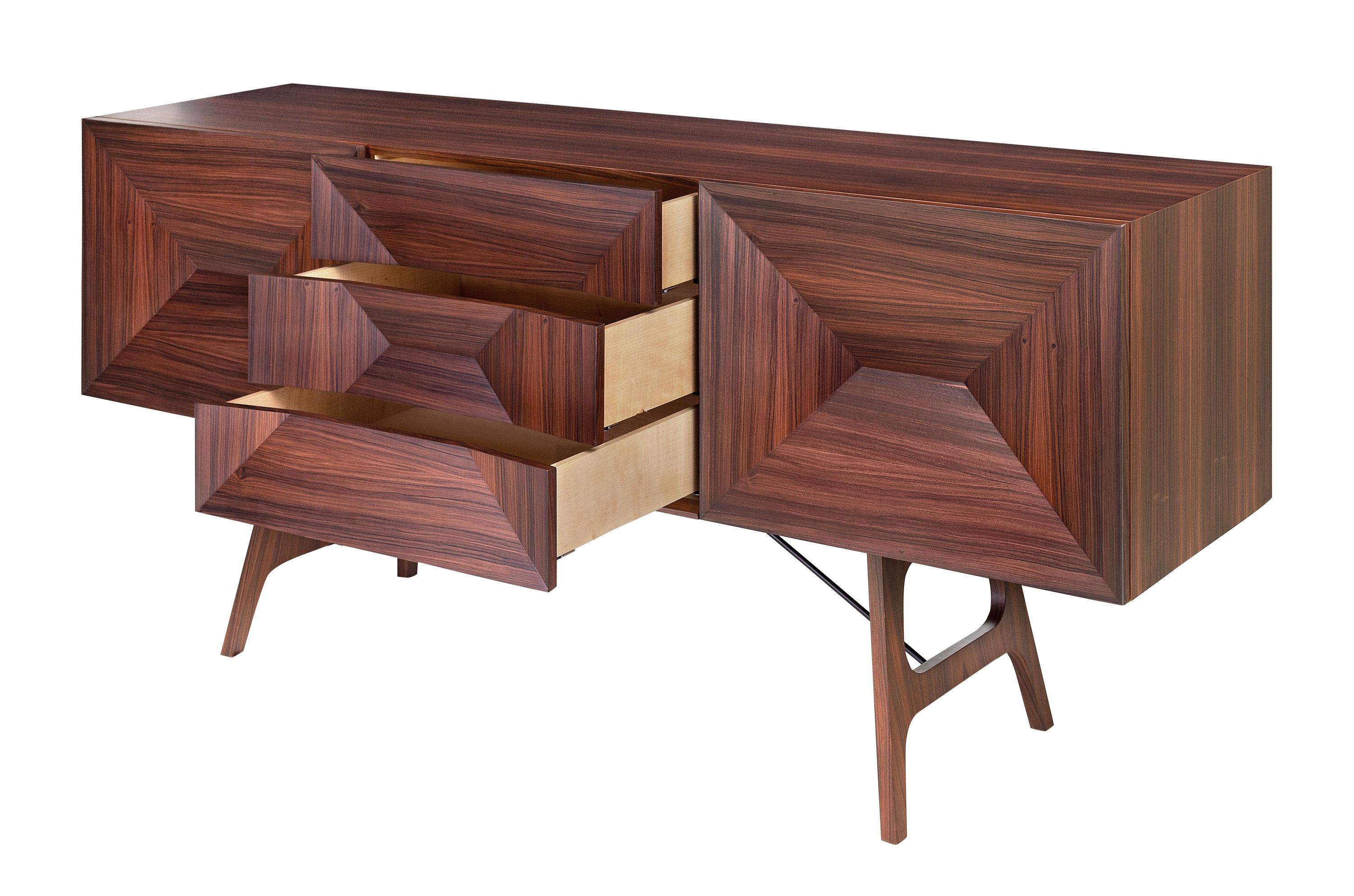 Midcentury style and Danish design rosewood sideboard composed of doors in each side opening on shelves and 3 chest of drawers in the middle. Harmonious lines and graphic design, aerial and fine wood work.