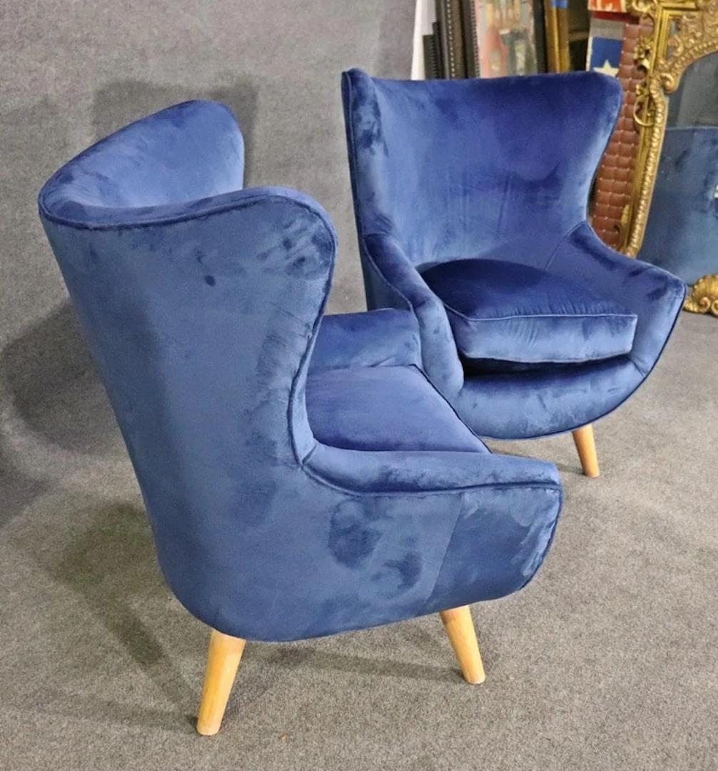 Unique modern style lounge chairs with cone legs. Soft velvet upholstery with wing back style.
Please confirm location.