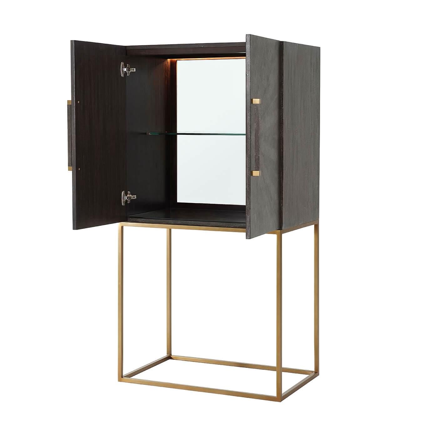 Midcentury style leather-wrapped bar cabinet with a primavera veneered case in our tempest finish starburst komoda embossed leather doors, with square baton handles with polished nickel finish clasps, polished nickel finish open cube base with a