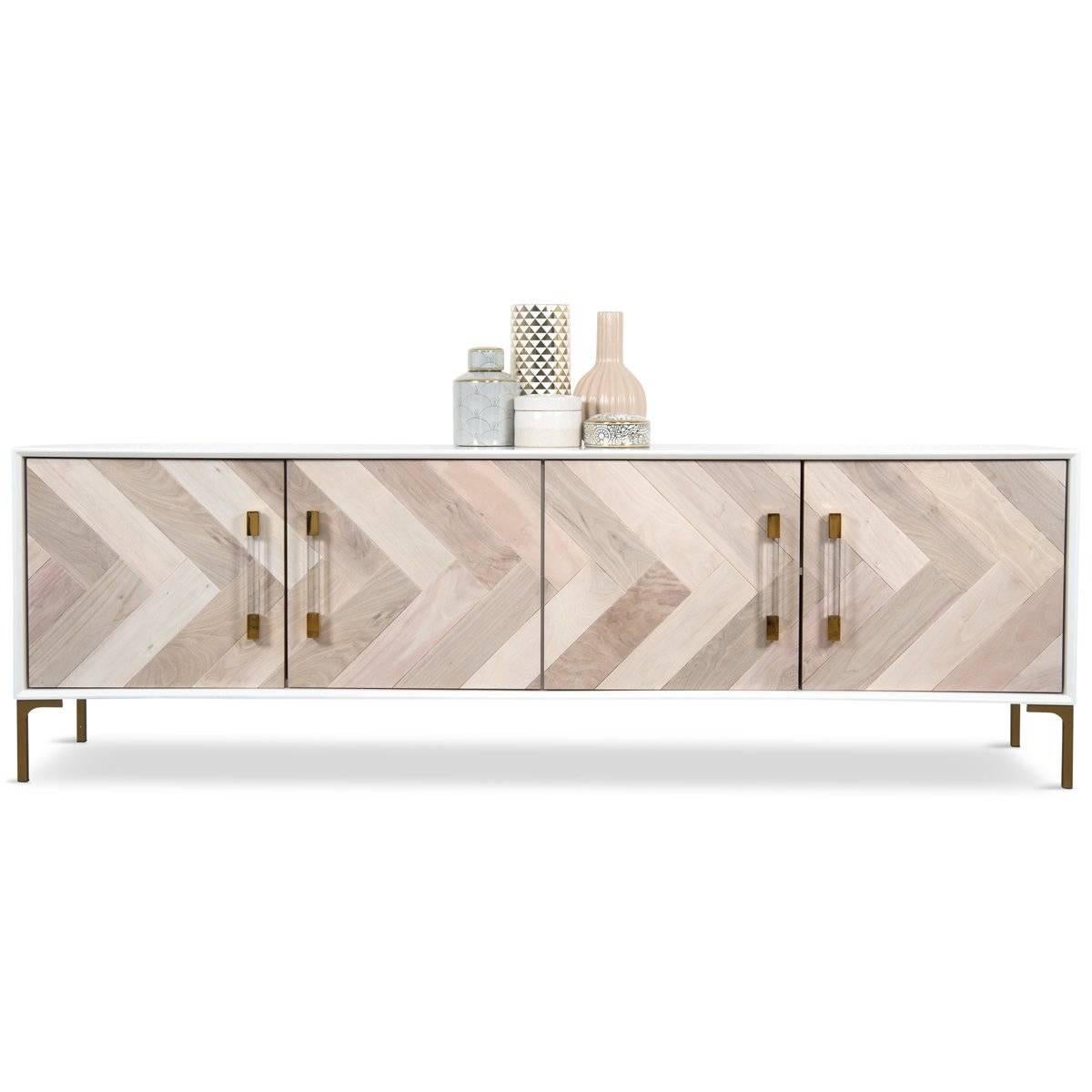 This four door credenza features hand cut bleached North American Walnut in a V shape pattern. With the matte white lacquer case finish and lucite brass hardware pulls, this piece would be a stunning addition to any space.
 
Dimensions:
84