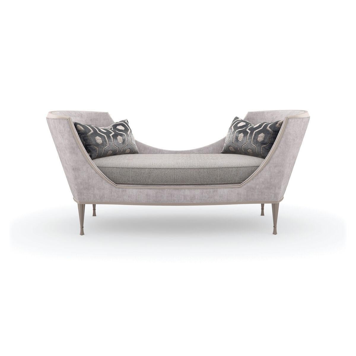 Wrapped in an irresistibly soft chenille, this gracefully curved chaise offers curl-up comfort for one (or two). Its enveloping silhouette features a pinstripe cord seat cushion and rounded shelter arms, artfully accented by a decorative metal rod