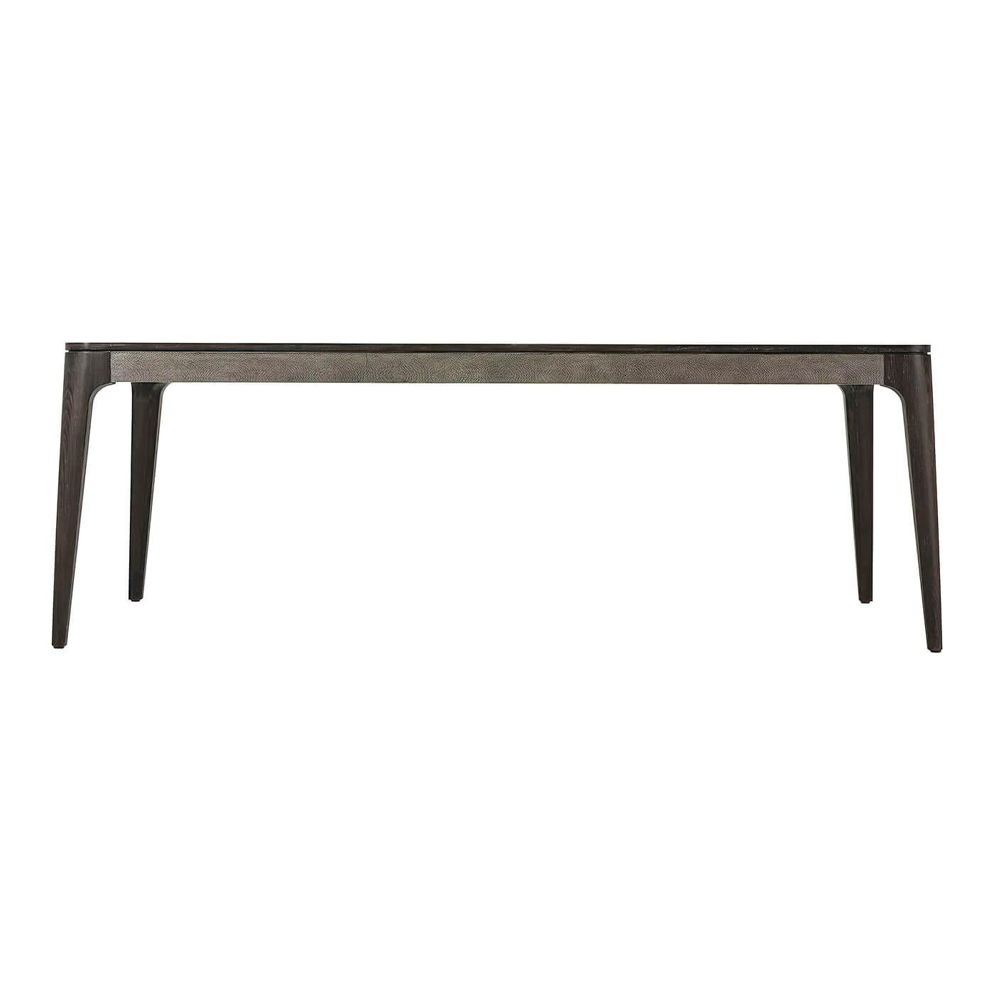 Mid-Century Modern style dining table with Rowan Primavera veneer and Komodo embossed leather frieze with tapering beech legs and rounded exterior edges.

Dimensions: 86
