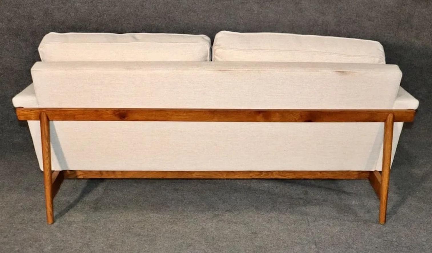 sofa with exposed wood frame