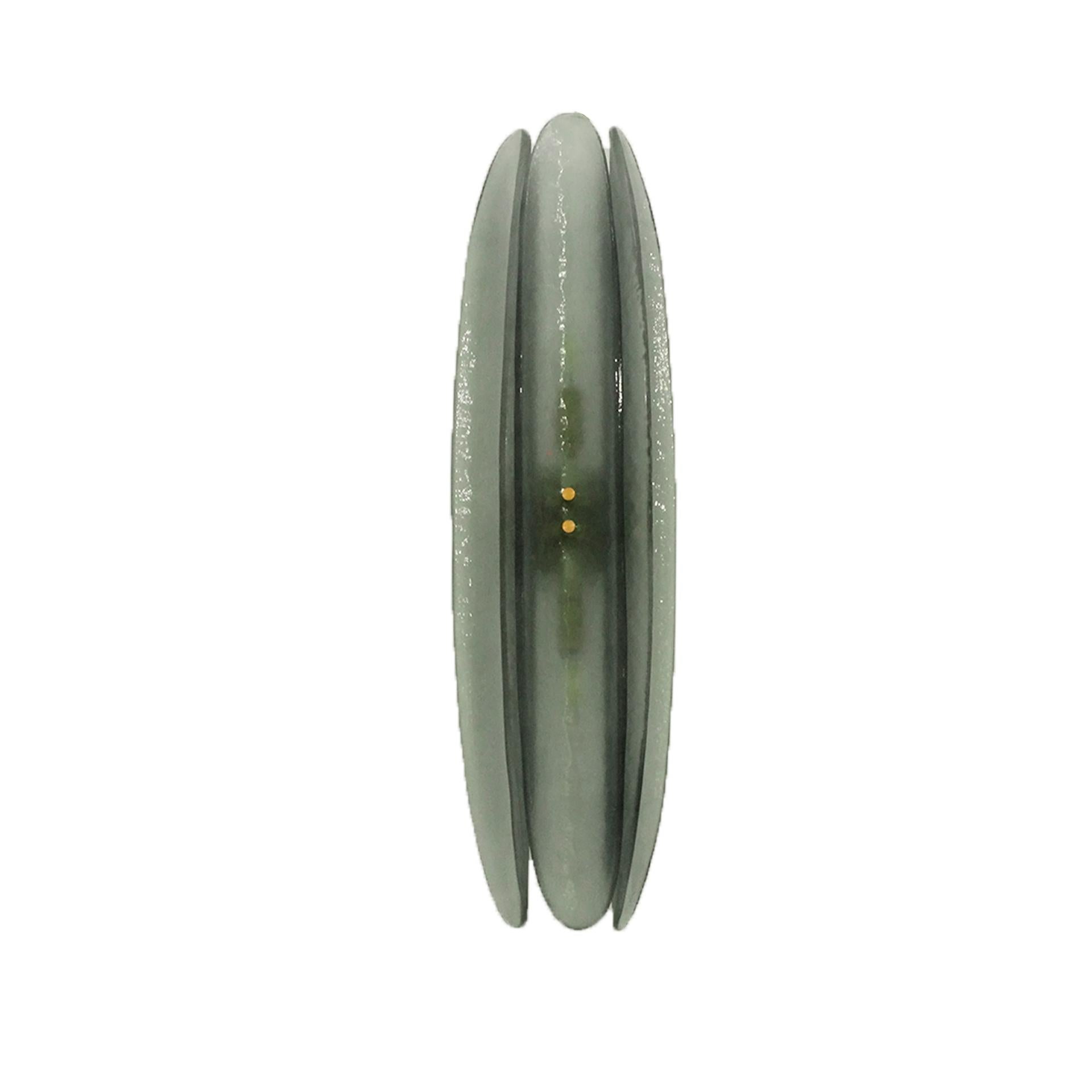 
Pair of Italian-designed wall lamps made of Scova Murano glass, featuring two light points and a brass structure. They have an oval design composed of three concave pieces. 

Every item LA Studio offers is checked by our team of 10 craftsmen in our