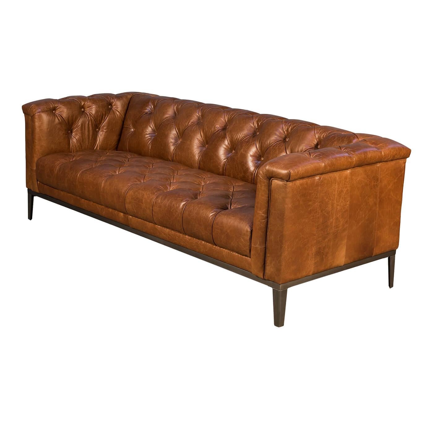 Mid-Century Modern style tufted leather upholstered sofa with a vintage brown top grain leather, with a tufted backrest and squared arms on metal base with square tapered legs.

Dimensions: 88