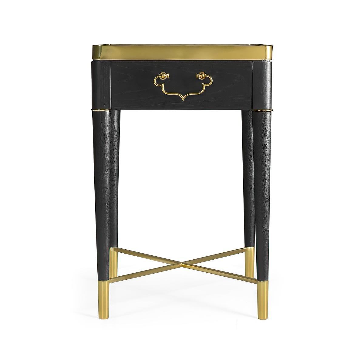 A French Mid-Century Modern style marble top side table with brass trim and hardware and an ebonized oak frame, with a single front drawer on turned and tapered legs joined by a brass X stretcher.

Dimensions: 18.25