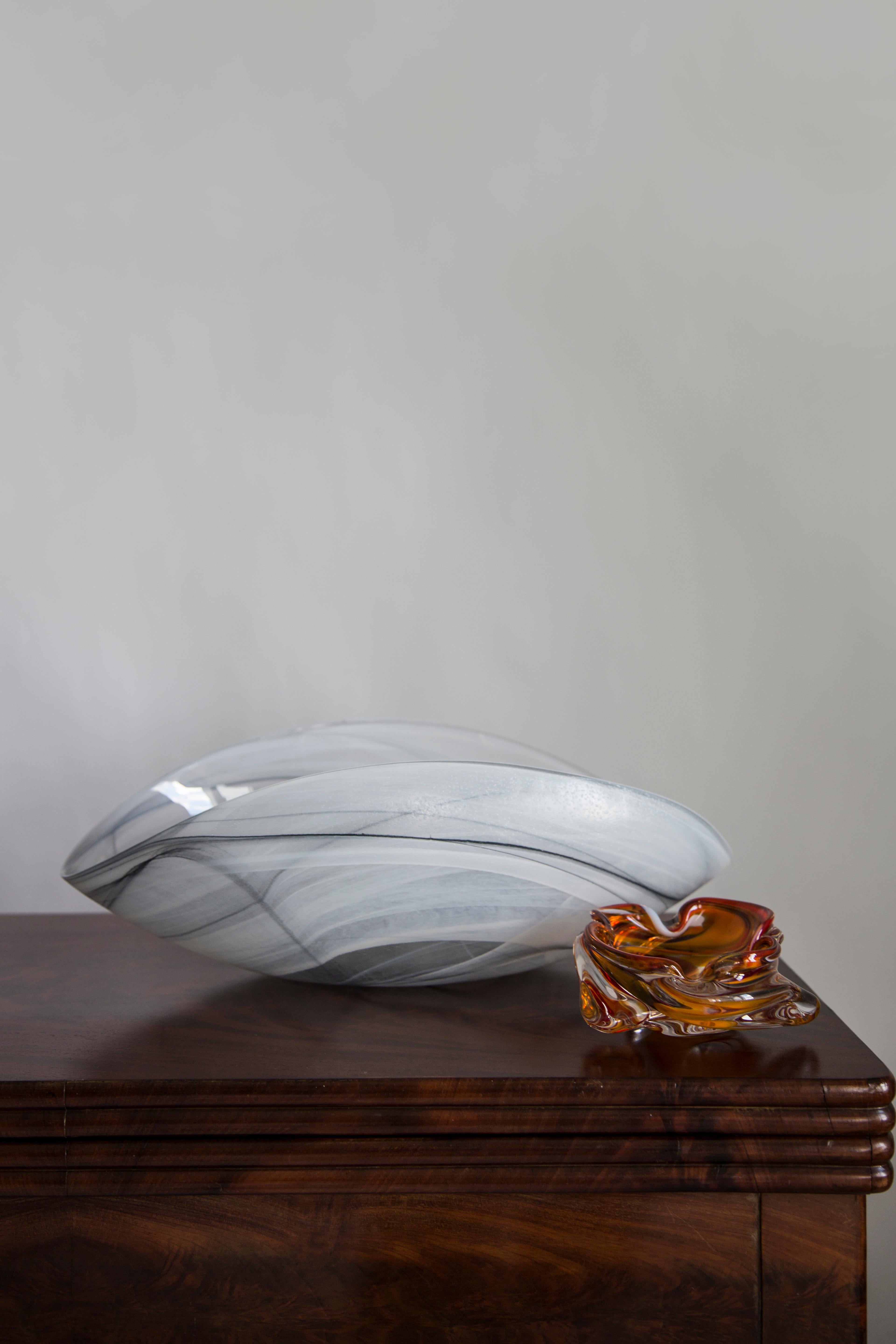 This original vintage glass element was designed and produced in the 2000s in Lombardia, Italy. It is made in Sommerso Technique and has a fantastic faceted form. The vibrant color makes this items highly decorative. This item is a high quality