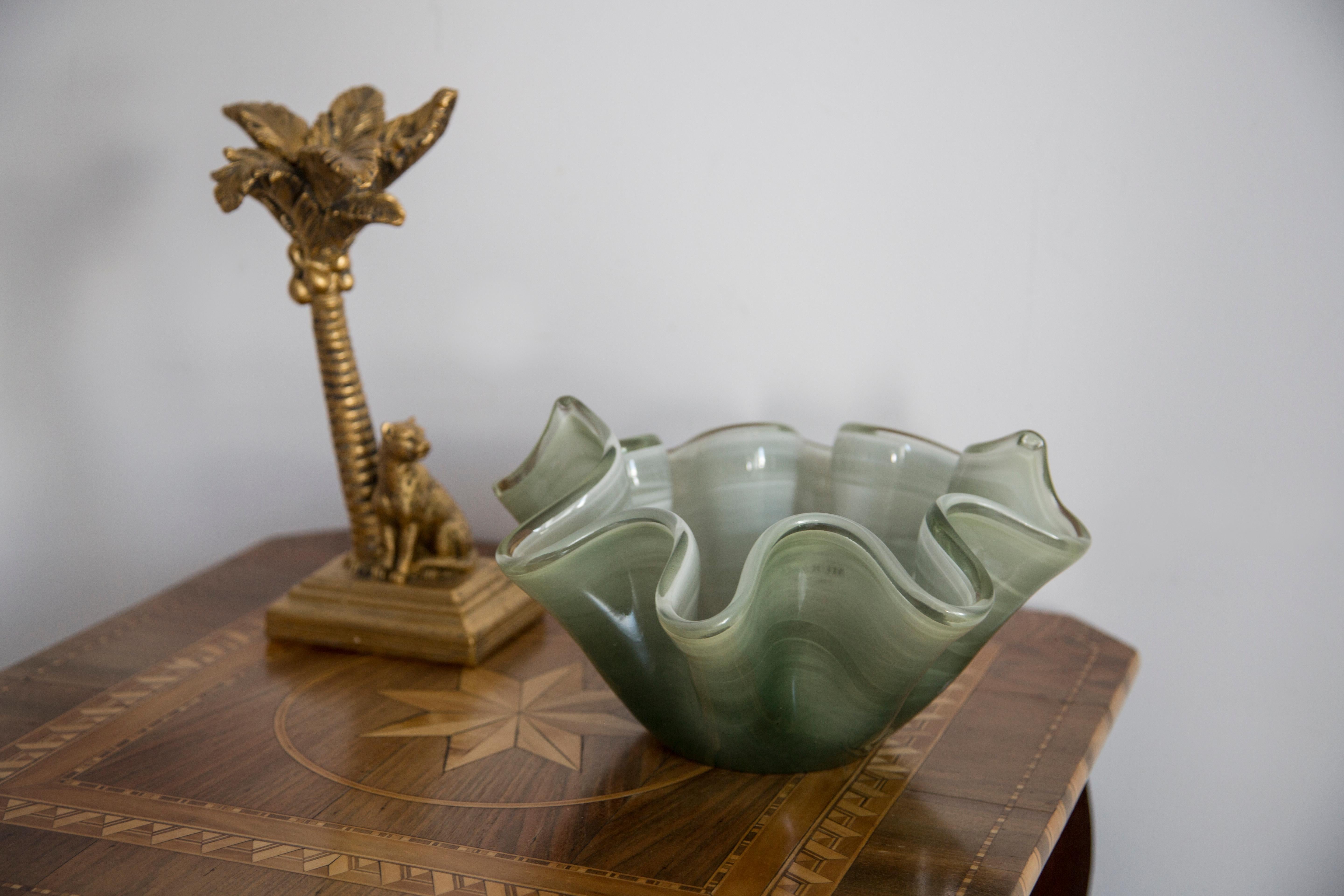 This original vintage glass element was designed and produced in the 2000s in Lombardia, Italy. It is made in Sommerso Technique and has a fantastic faceted form. The vibrant color makes this items highly decorative. This item is a high quality