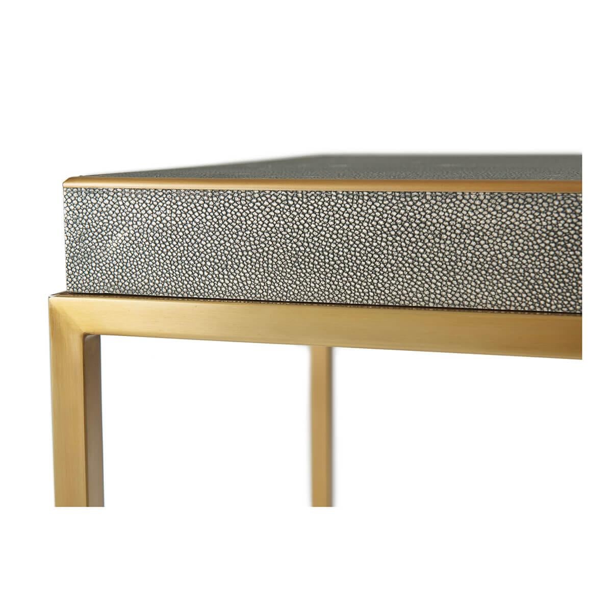 with a shagreen embossed dark tempest finish leather top, with brushed brass trim and open cubed form base.

Dimensions: 28
