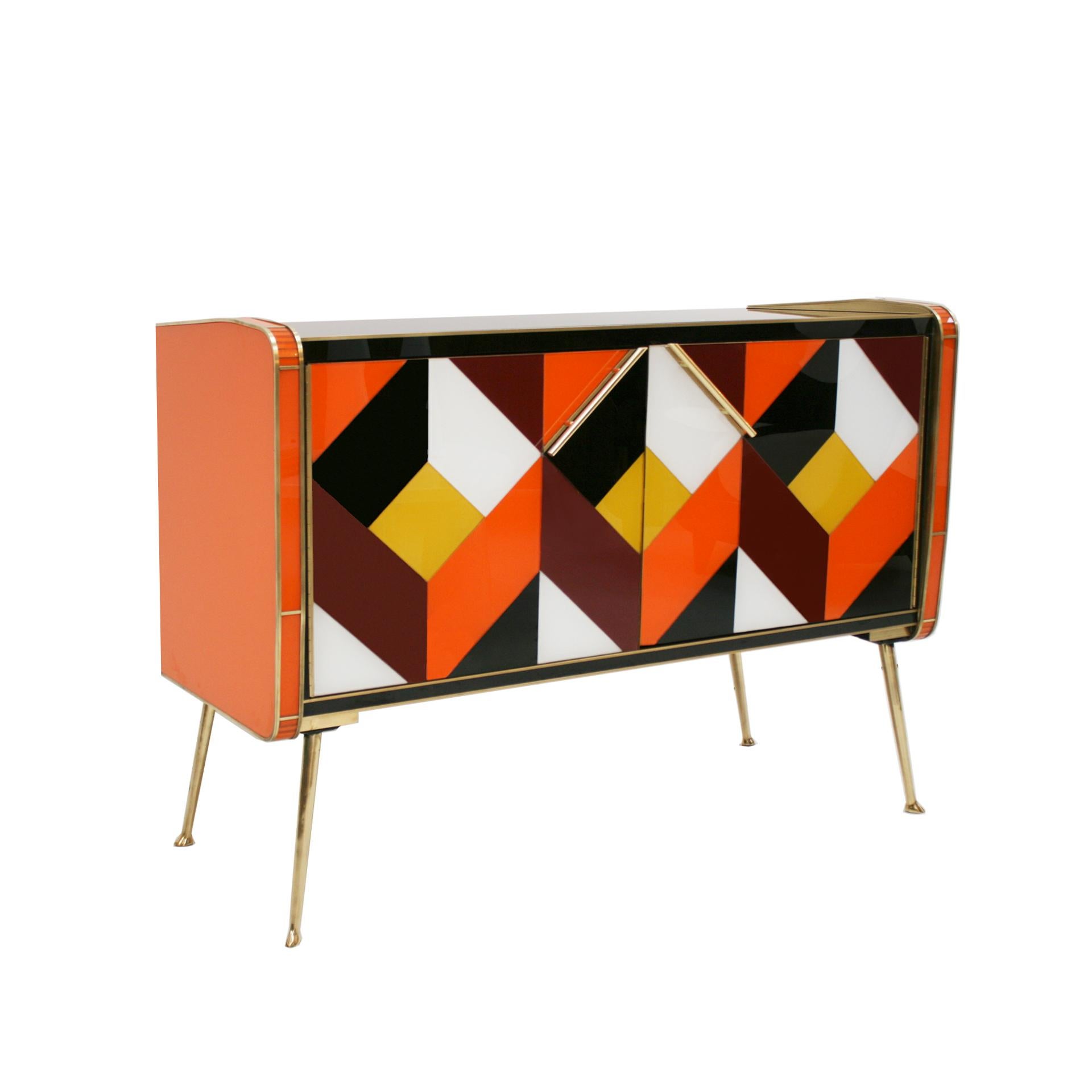 Italian sideboard composed of two folding doors and one shelve inside. Original wood structure from 1950s covered with colored glass. Handles, profiles and legs made of solid brass. Italian manufacture.

Our main target is customer satisfaction, so