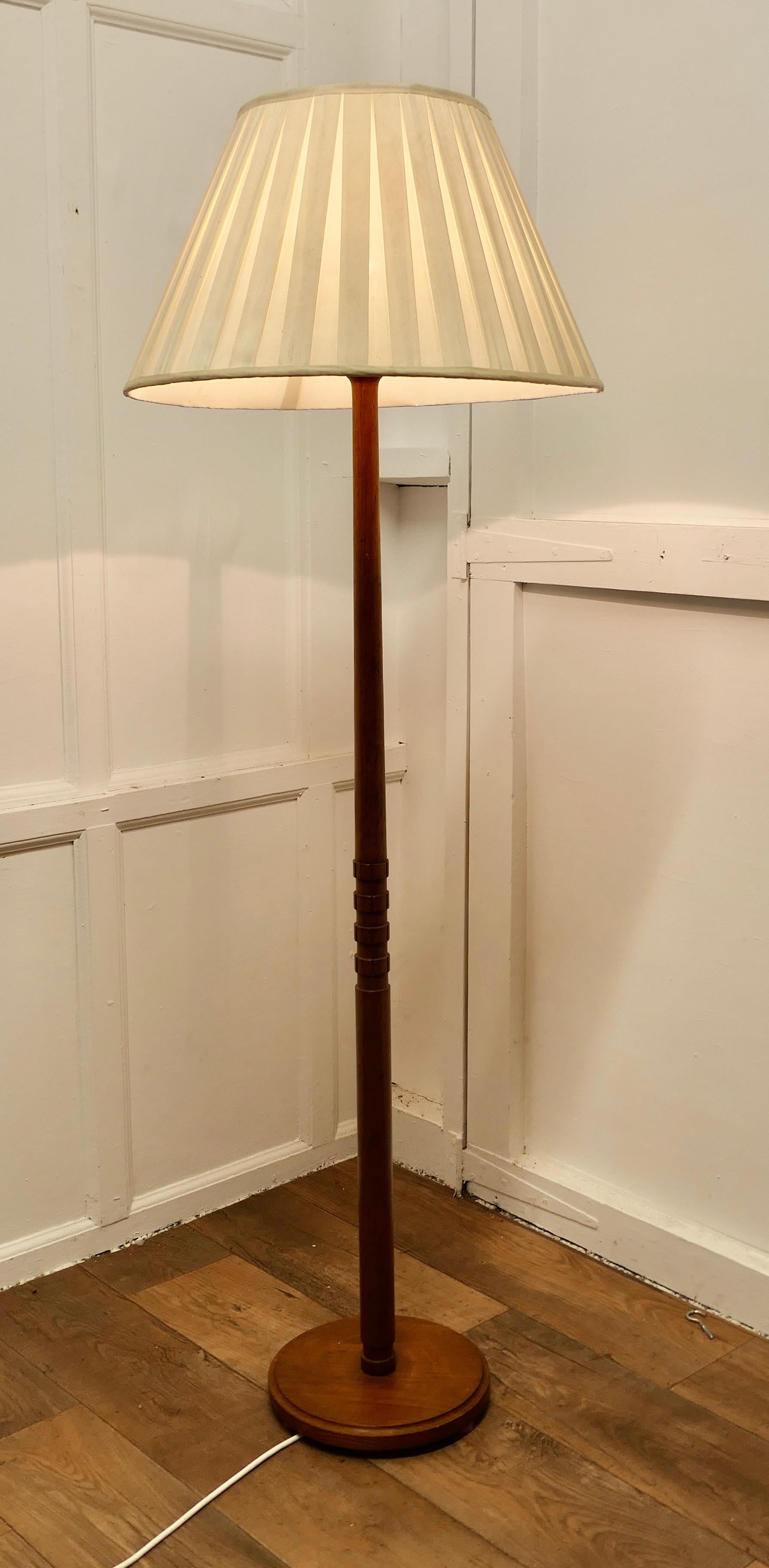 Mid Century Style Teak Standard or Floor Lamp 

This is a very stylish piece, the round teak base of the lamp has a moulded edge and the column is turned in a retro style
The lamp is in good condition, working and is shown with a used lampshade,