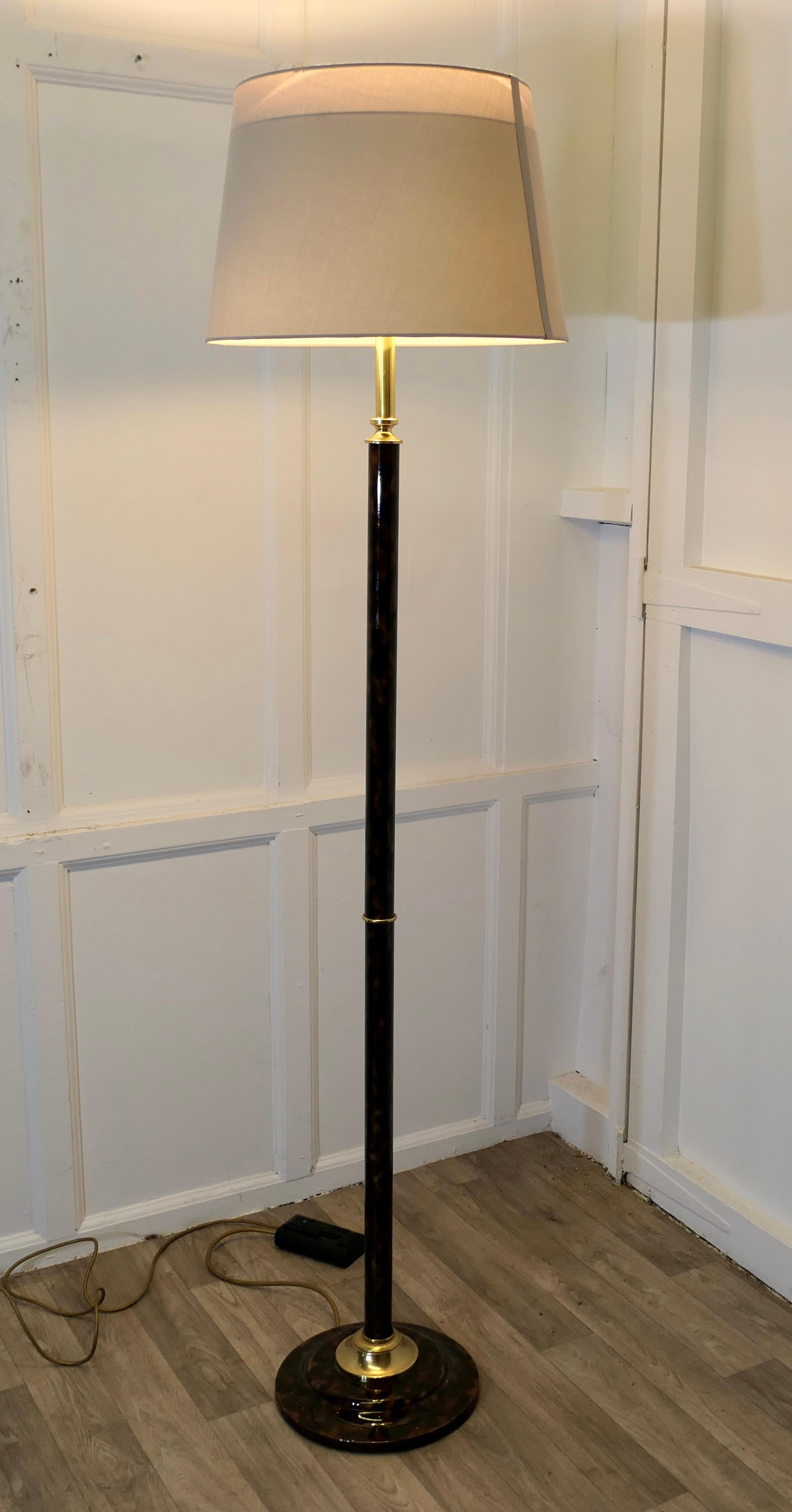 Mid Century Style Tortoise Shell Standard or Floor Lamp 

This is a very stylish piece, the round base of the lamp and the column have a simulated tortoise shell finish
The lamp is in good condition, working and has both an up light and 2 downward