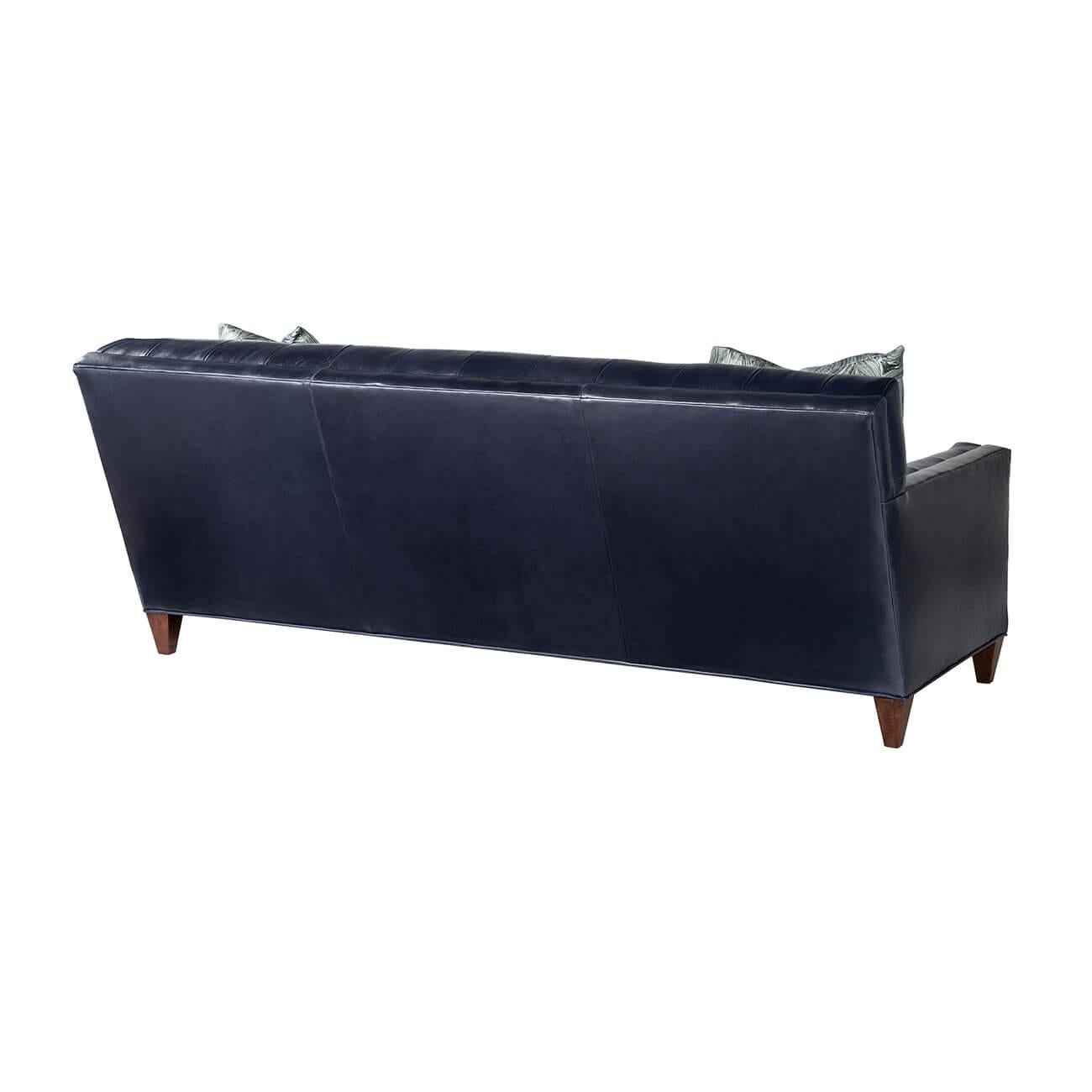 A modern Classic tufted sofa, built with a solid maple frame and constructed with 8-way hand-tied craftsmanship, with a biscuit tufted back and inside arm, with individually cut and sewn panel. Comes with two throw pillows.

COM and other fabrics