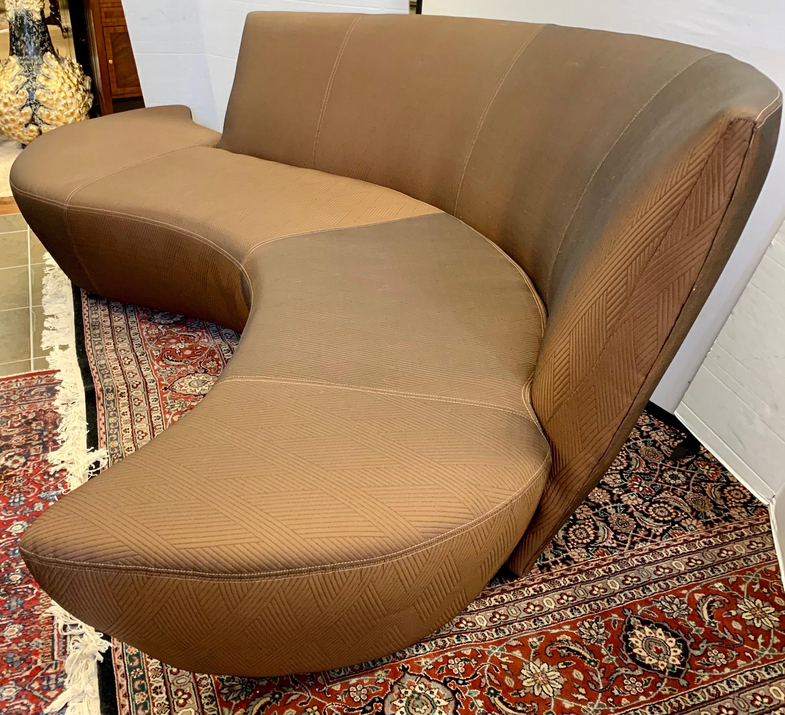 A sculptural modern sofa designed by Vladimir Kagan and inspired by the curves and undulations of the Guggenheim Museum in Bilbao, Spain. It has newer upholstery done in the last few years and is stunning. Rare to see a serpentine Kagan sofa in such