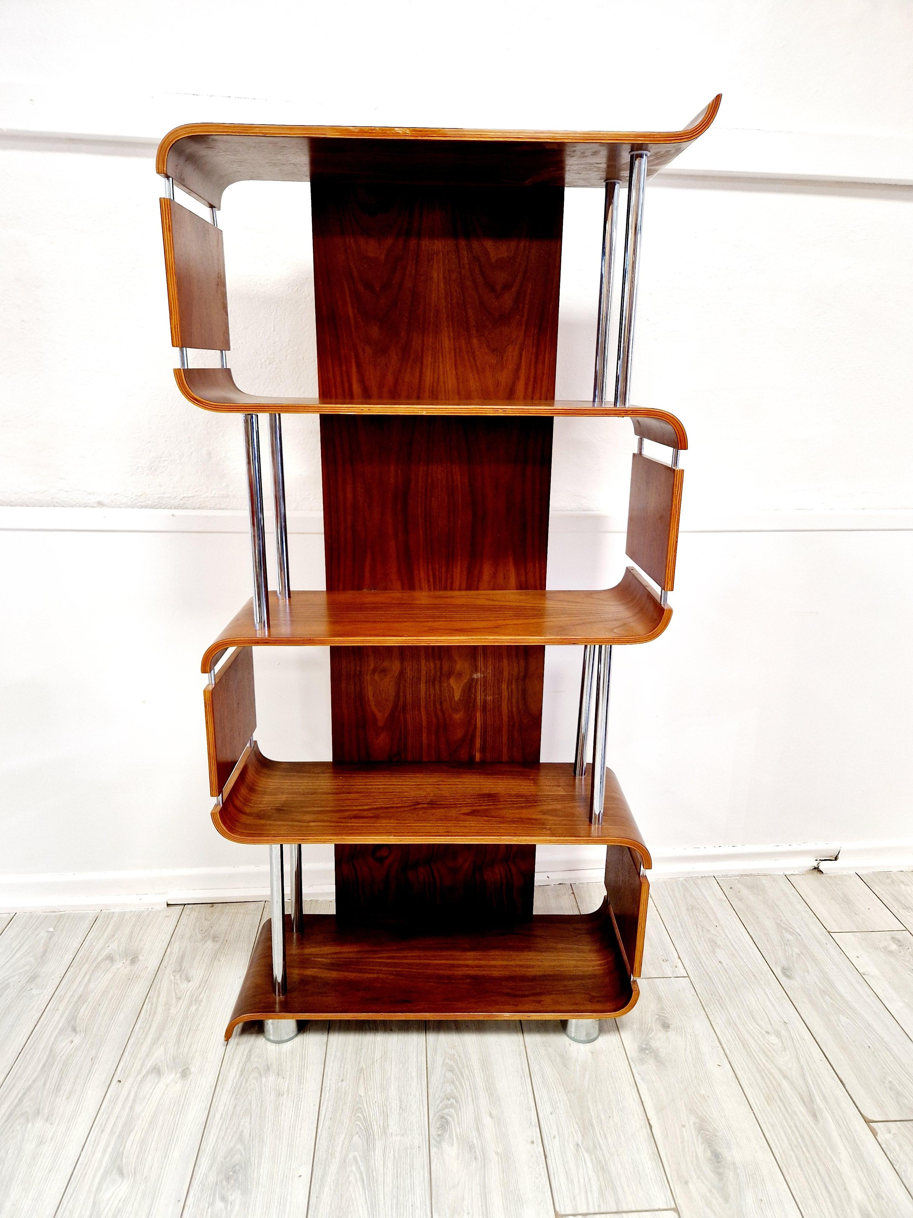 This Vintage Style Walnut Bentwood Shelving Unit is a stunning piece of mid-century modern style furniture, perfect for people looking to add a touch of vintage charm to their home. Made from walnut with a chrome accent, this rectangle-shaped