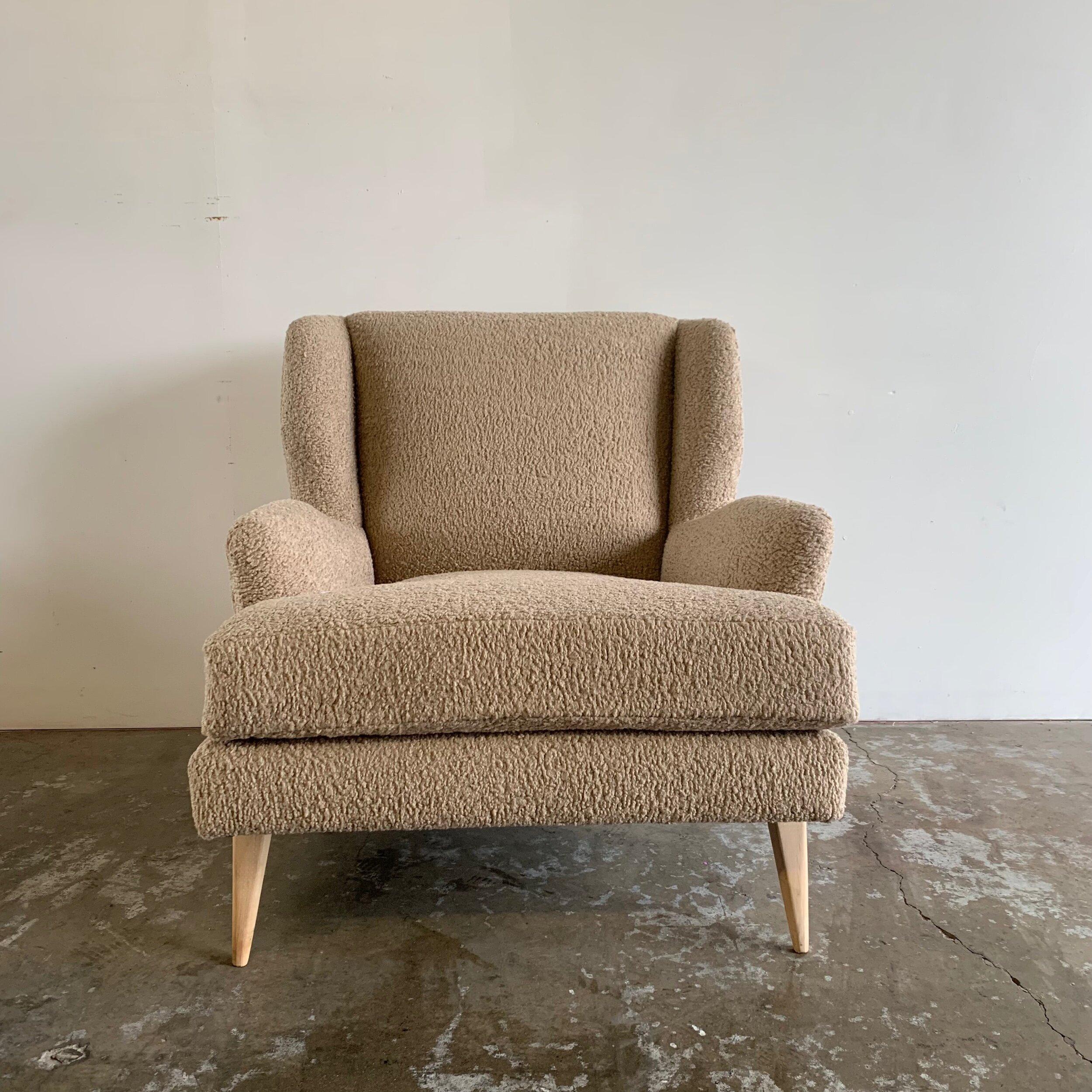Handcrafted wingback chair in toast Sherpa fabric. Item can be custom made in preferred wood, upholstery, and dimensions for around the same price point or additional fees depending on materials. Lead time 2-3weeks.