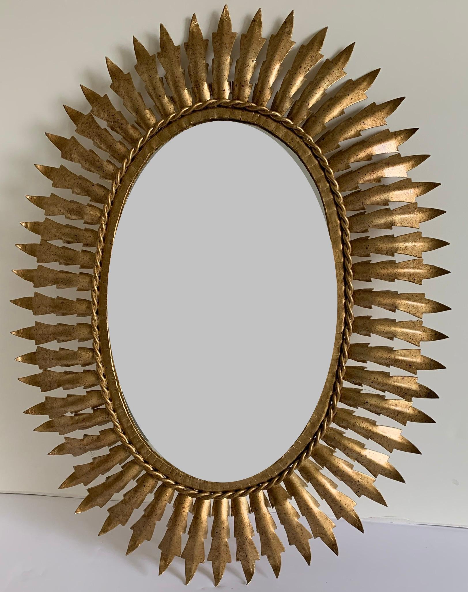 Midcentury Italian gilt metal sunburst mirror. Newly painted in an antique gold finish with original mirrored glass. Glass portion is 14” tall x 9” wide.
Back wire for hanging. Hanging hardware not included.