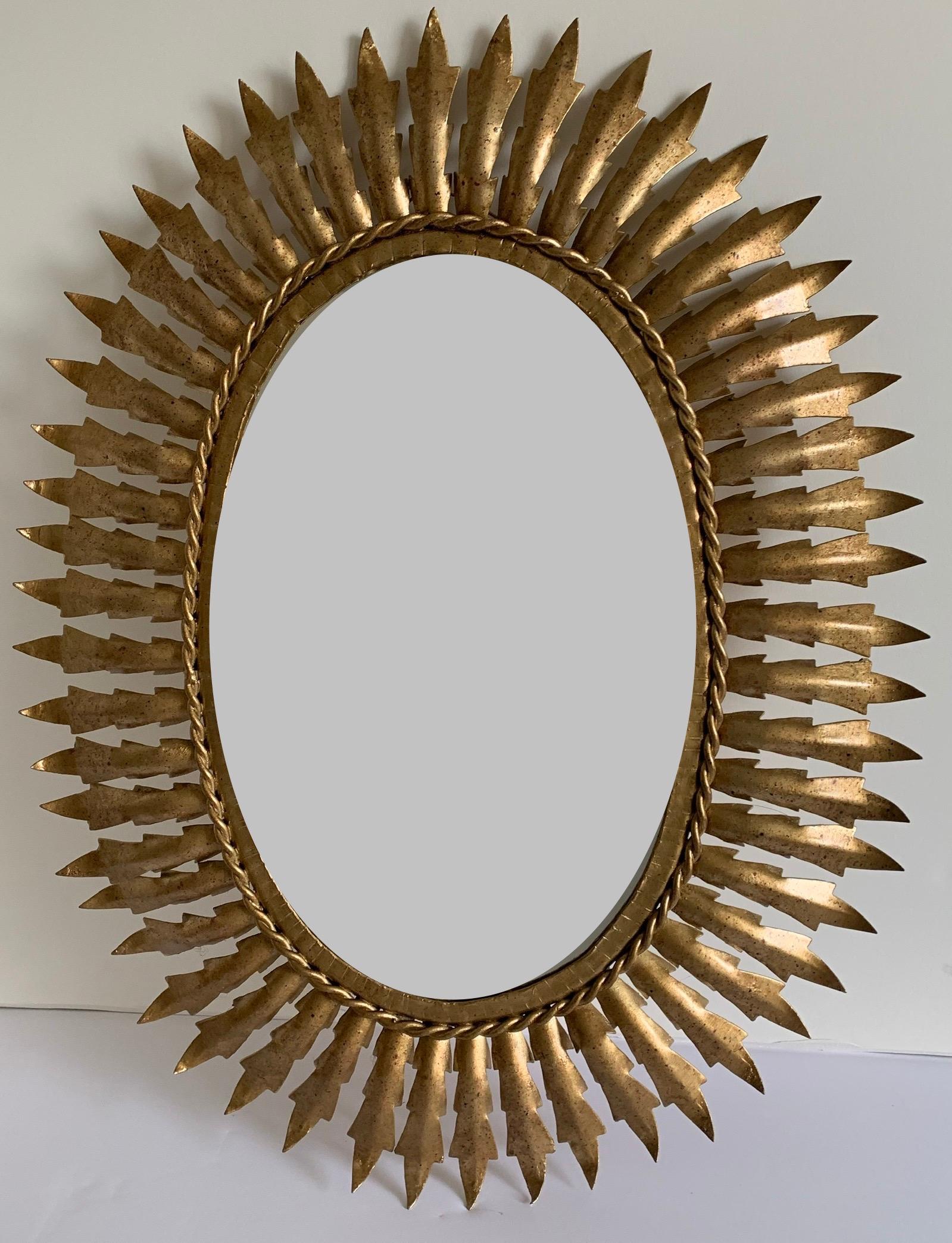 Midcentury Sunburst Gilt Metal Oval Mirror In Good Condition In Stamford, CT