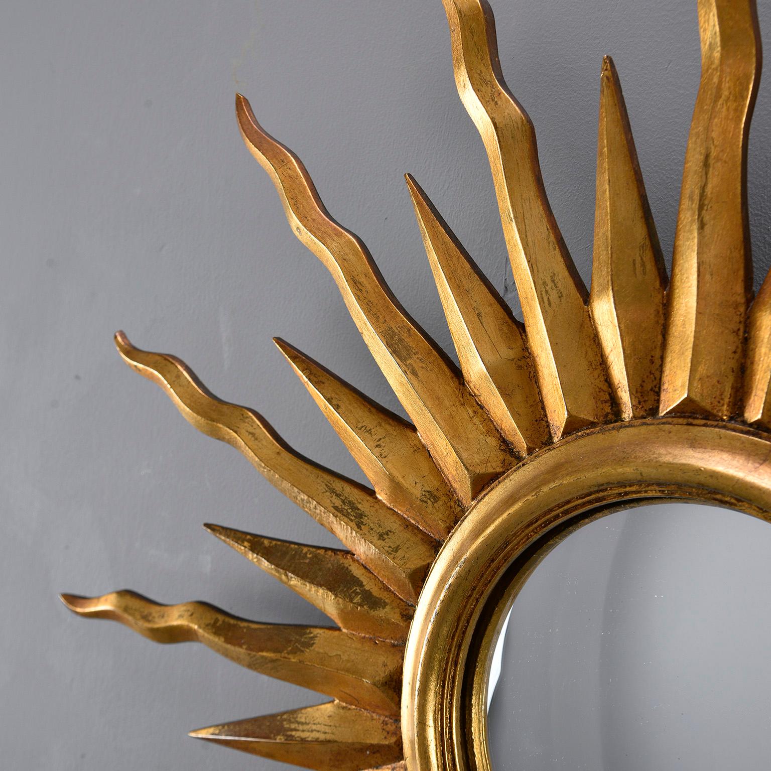 Giltwood sunburst mirror found in Italy, circa 1960s. Alternating short and long rays. Marks on back say Huis Herbert.
      