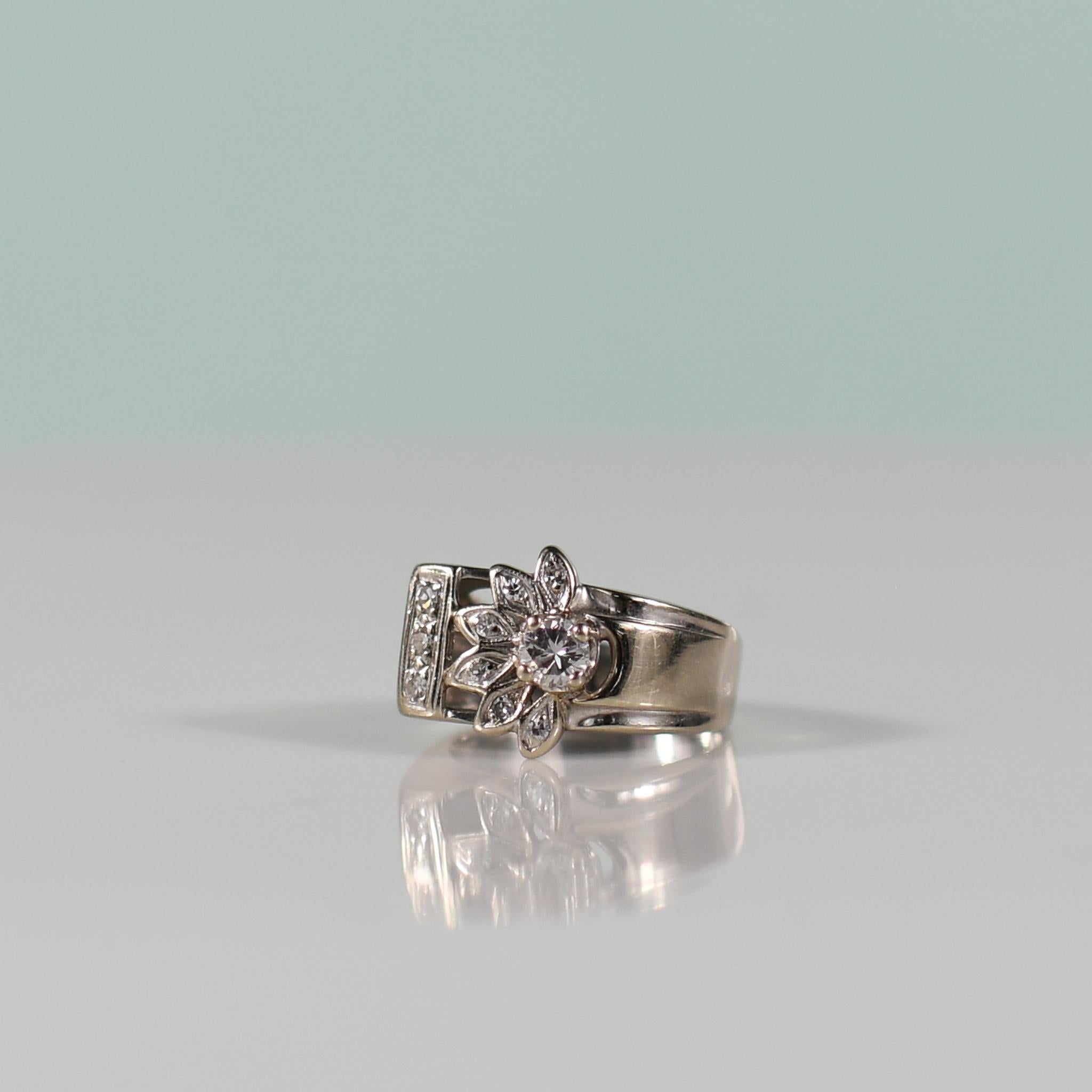 Indulge in the vintage charm of the mid-century era with this captivating half sunflower diamond ring. Its centerpiece features a dazzling 0.33 carat round brilliant cut diamond, radiating brilliance and elegance. Surrounding it are nine accent