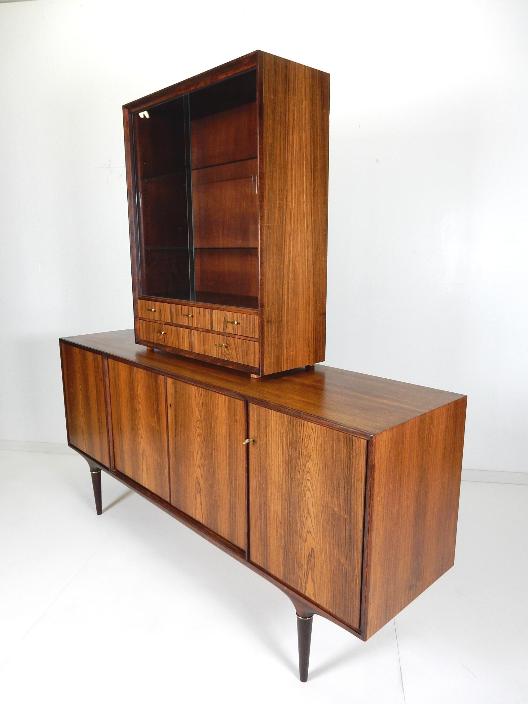 Sensational 2-tone rosewood buffet by Svante Skogh of Sweden.
Gorgeous rosewood exterior and secondary birch wood inside 
Key lock cabinet doors opening to storage shelf's in center and right with 6 drawers on left side.
Rare floating footed barware