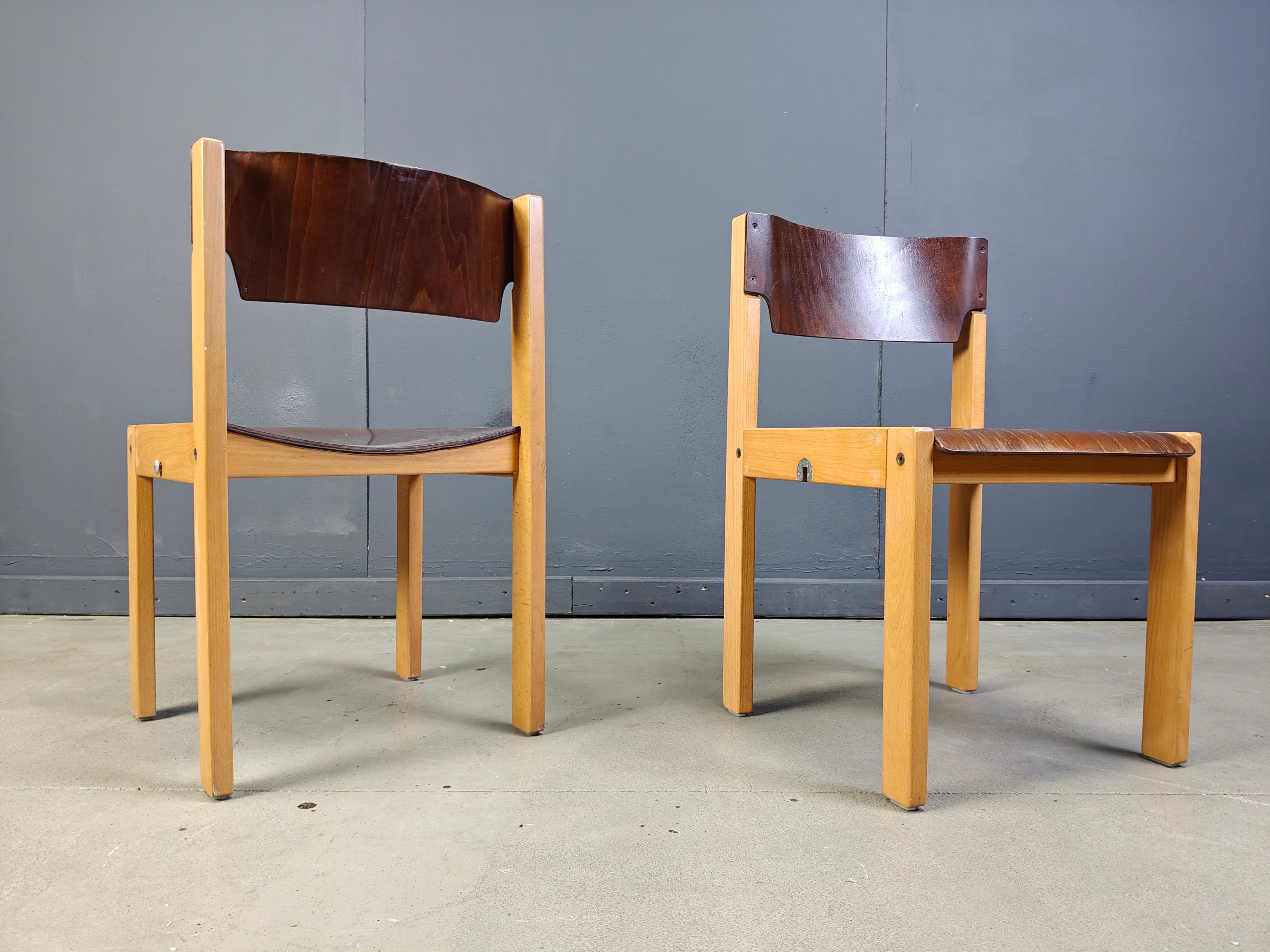 Sven Markelius style two-toned stacking chairs with simple modernist birch frames and brown seats and backs.

The chairs are stackable and also attach to one another.

Good condition with normal age related wear

1980s - Denmark