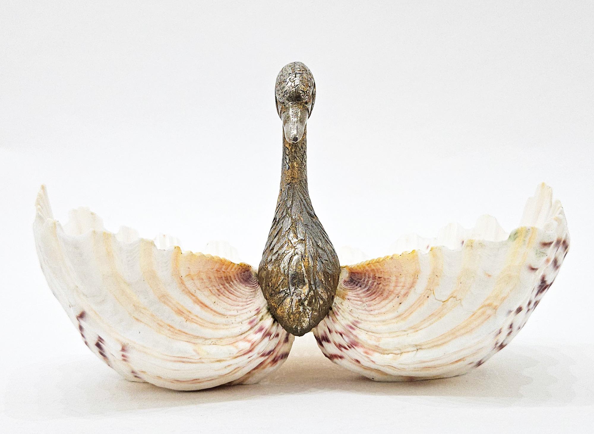 A very unusual Hollywood Regency / Palm Beach Modern style trinket or bathroom dish in the form of a swan with double clam shell wings, in the style of Gabriella Binazzi and made in Italy c. 1970.

This is a wonderful example of eccentric Italian