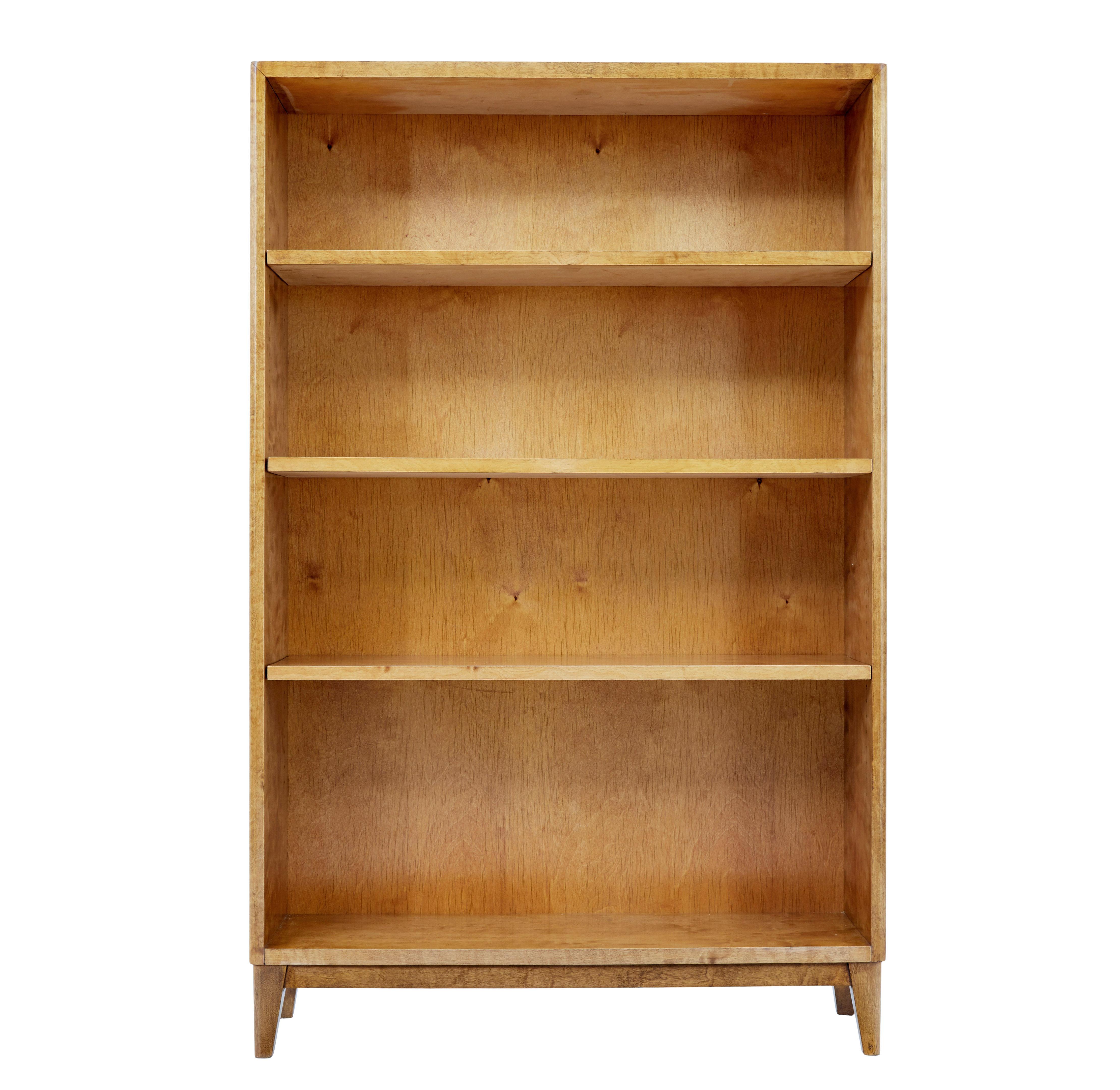 Mid century Swedish birch open bookcase circa 1950.

Elegant piece of mid 20th century Scandinavian design.  Rich golden birch veneers around the top and sides.  Fitted with 3 fully adjustable shelves, ideal for book or ornament storage.

Standing