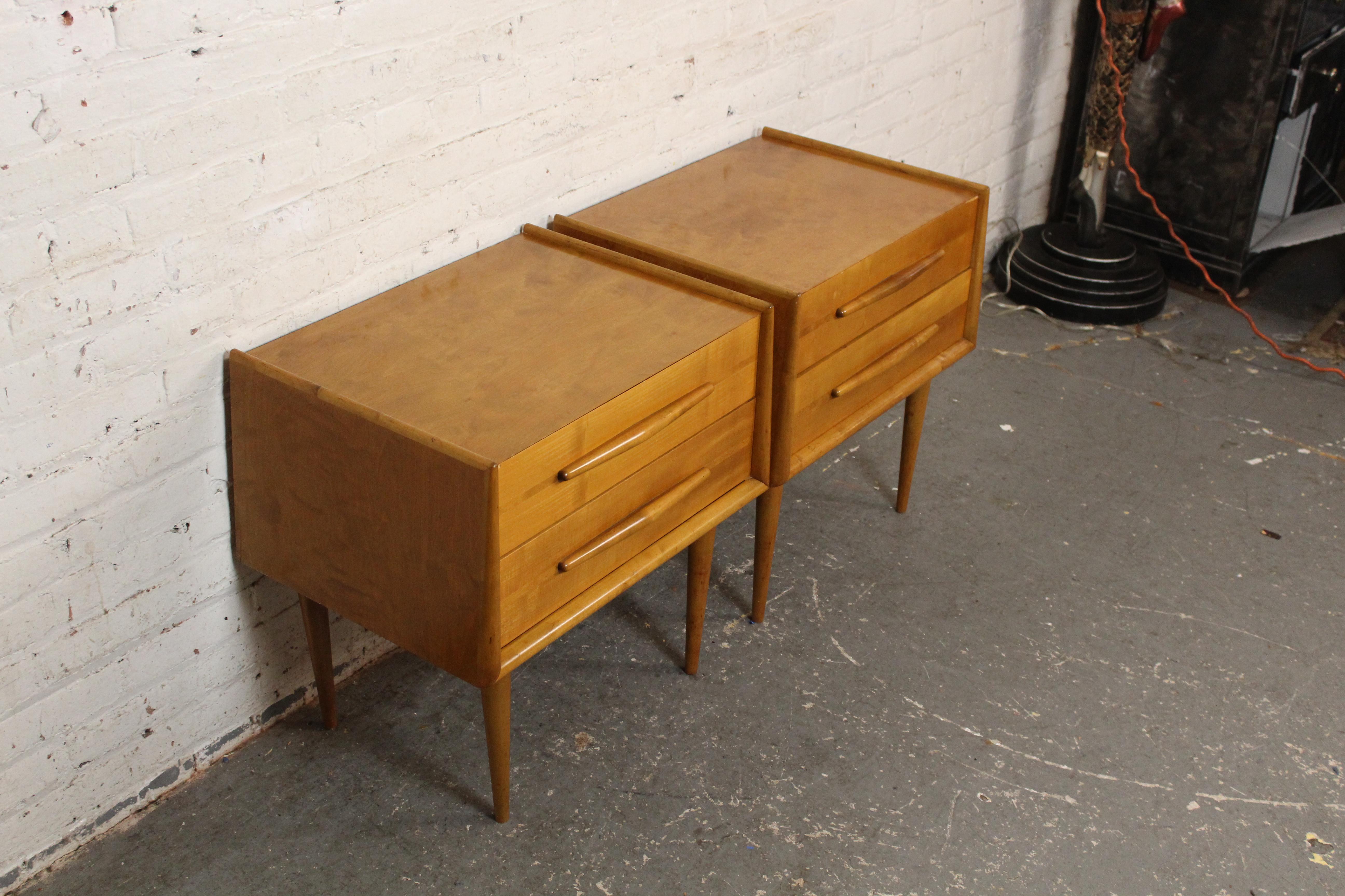 From one of the most visionary designers in Mid-20th Century Modern furniture, these truly exceptional nightstands by Edmond J. Spence (1911-1986) are sure to stand out in any room. Manufactured in Sweden, this striking pair boasts a beautiful birch