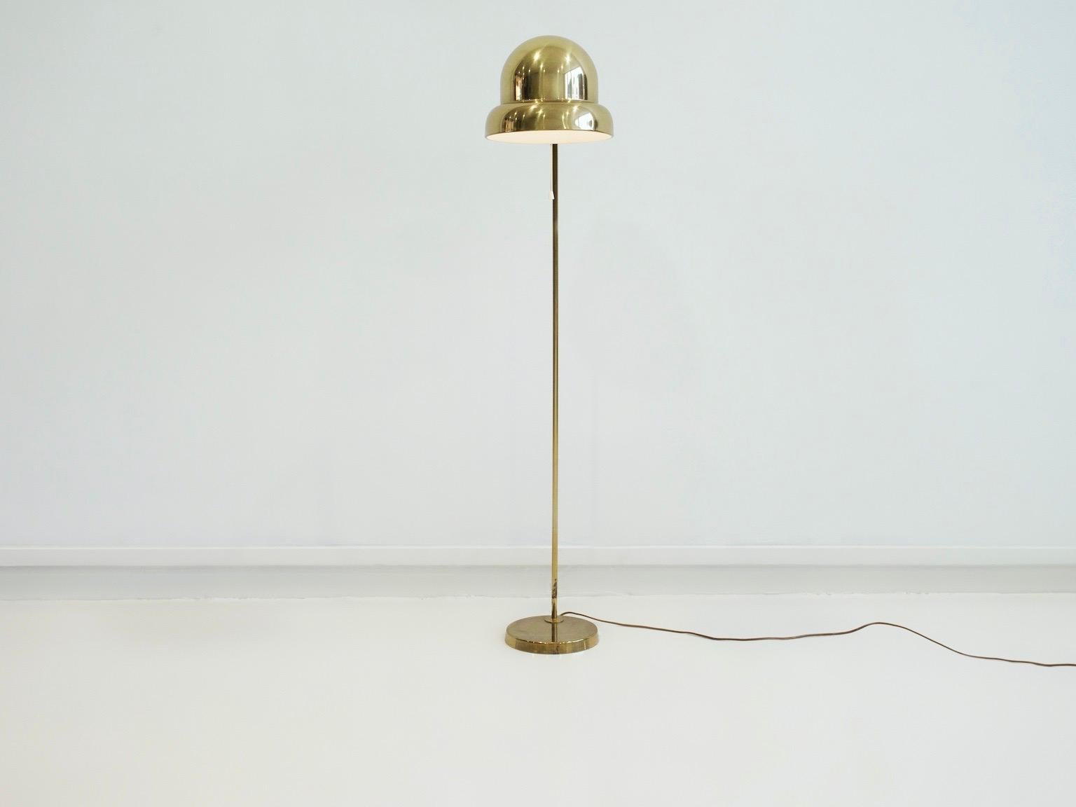 Floor lamp manufactured by Bergboms in the 1970s. Frame and screen in brass, foot in iron. Label marked underneath. Slight age-related wear on foot.