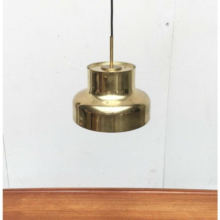 The bumling by atelje lyktan based on a design by anders pehrson from the 1960s. Here in a special version in brass.

A timeless classic of scandinavian design. Especially here the brass version. These older versions are of heavier quality. The lamp