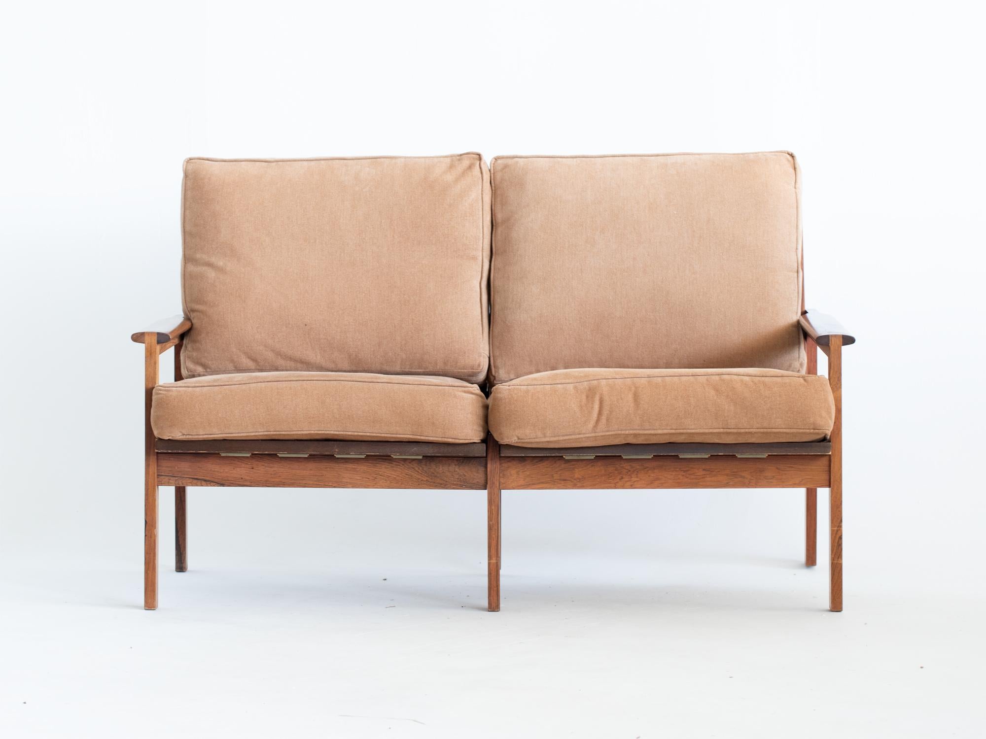 A mid-century upholstered teak Capella sofa by lllum Wikkelso for Niels Eilersen. Danish, c. 1960s.

In good solid order with light cosmetic wear to the frame. The cushions’ later upholstery is clean and servicable as is.

80 x 129 x 76 cm (31.5 x