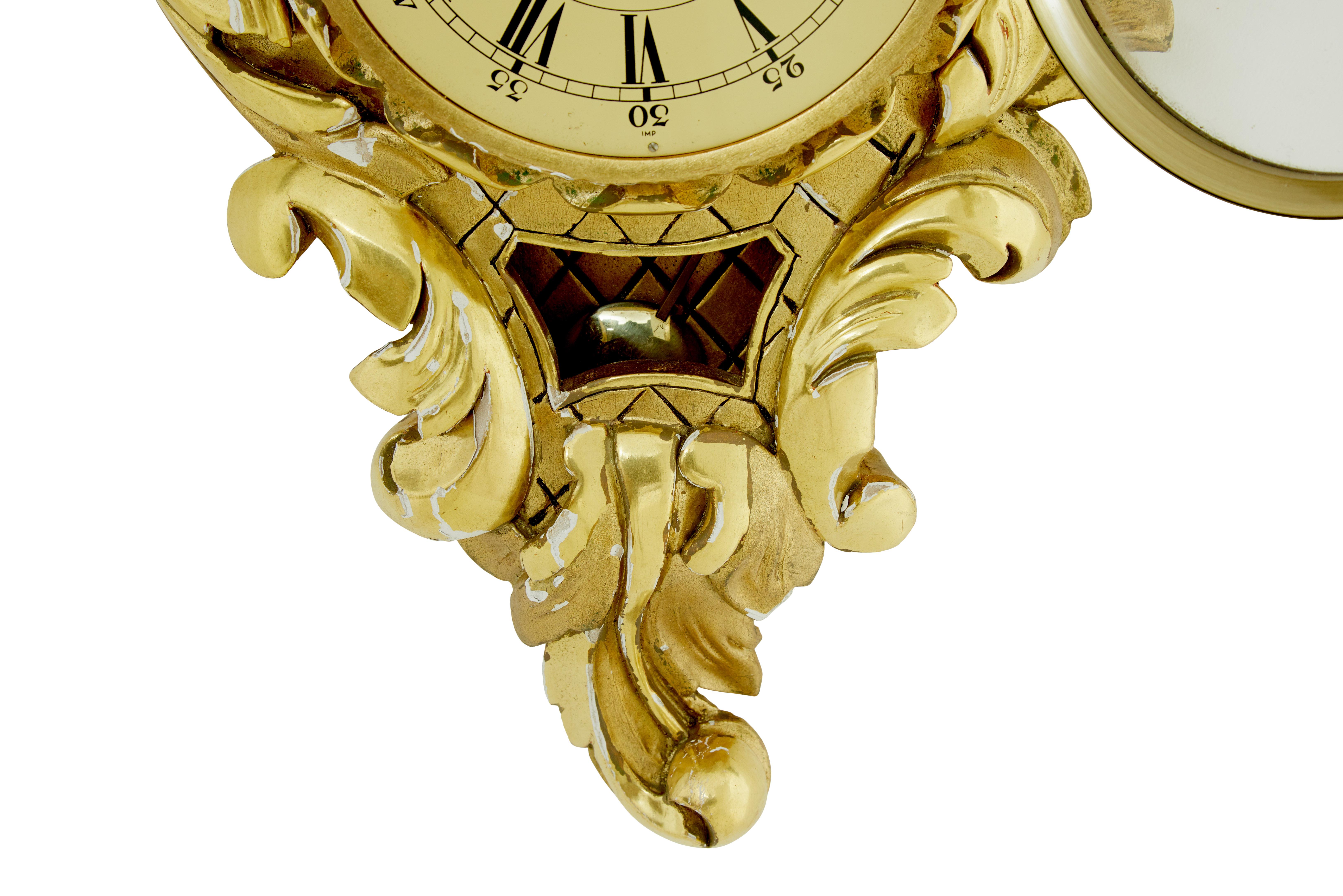 Hand-Crafted Mid century Swedish carved rococo revival gilt wall clock For Sale