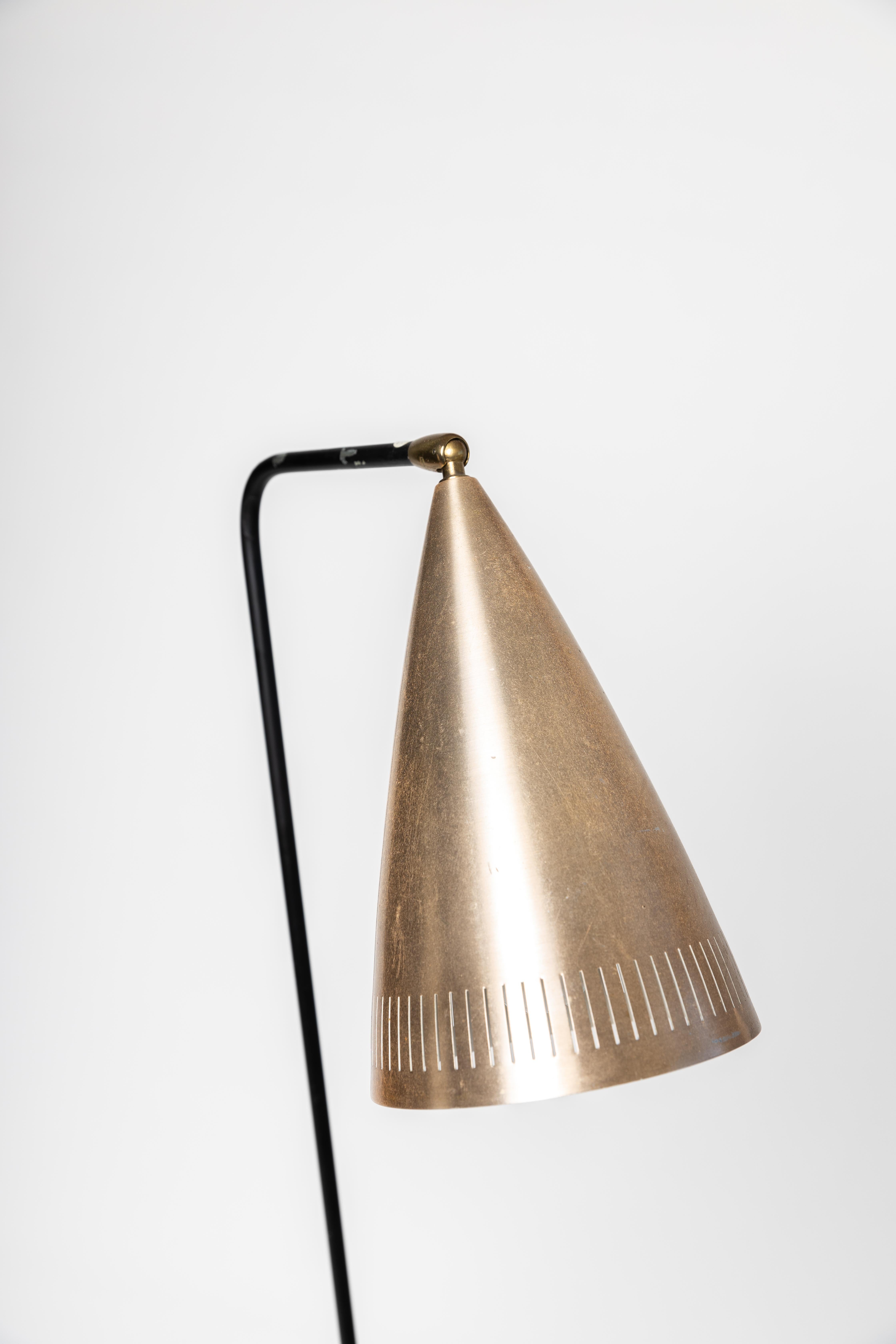 Mid century floor lamp, attributed to Danish designer Svend Aage Holm Sørensen for Swedish company ASEA. Probably from the 1950s. Lot of similarities to the Grasshopper light.

Golden light shade and black lacquered body. 
The light is tested and