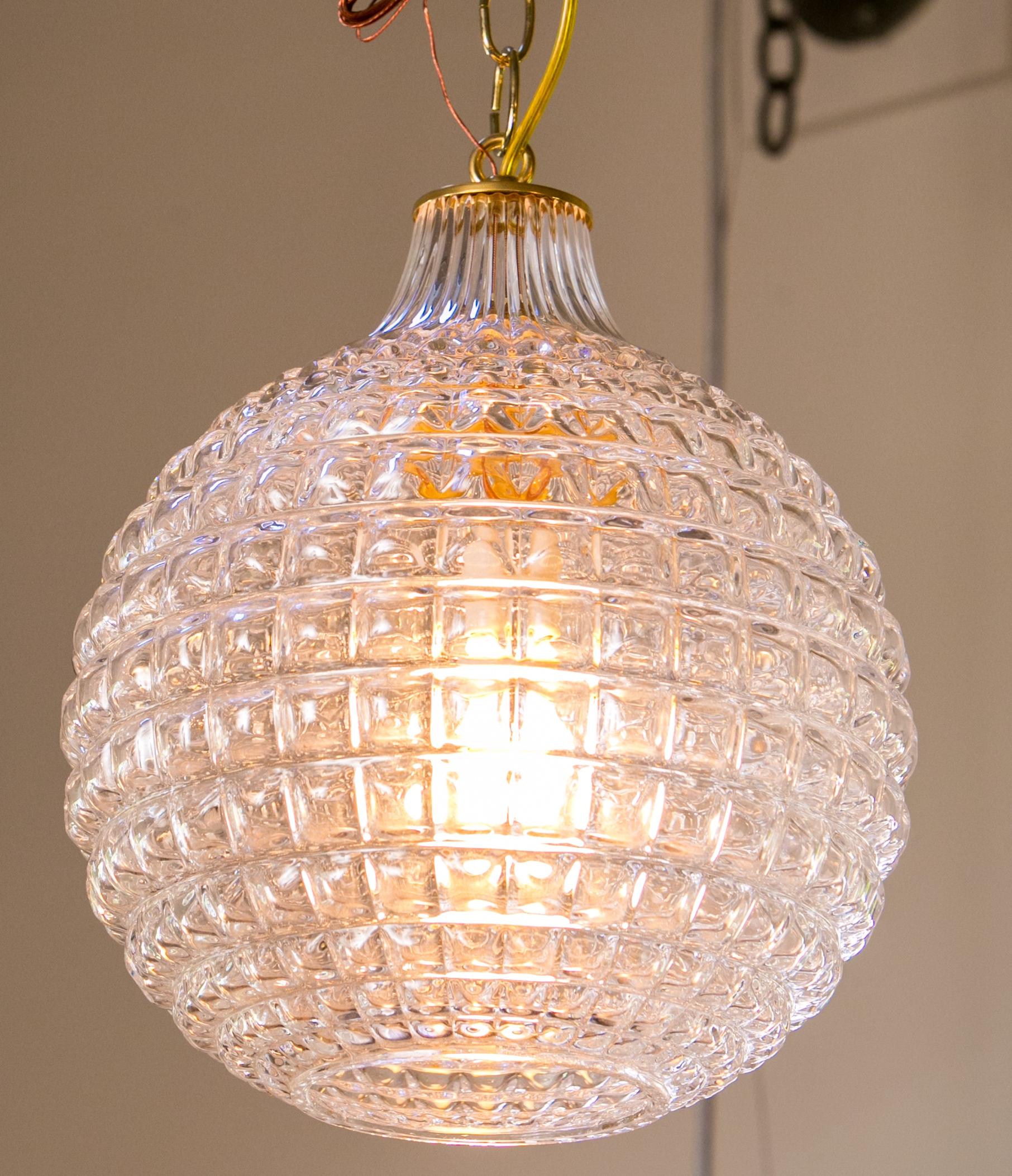 Midcentury Swedish glass pendant in a globe shape. Newly wired for use within the USA for a single medium-size (Edison) light. Includes chain and a canopy. We have 4 of them available.