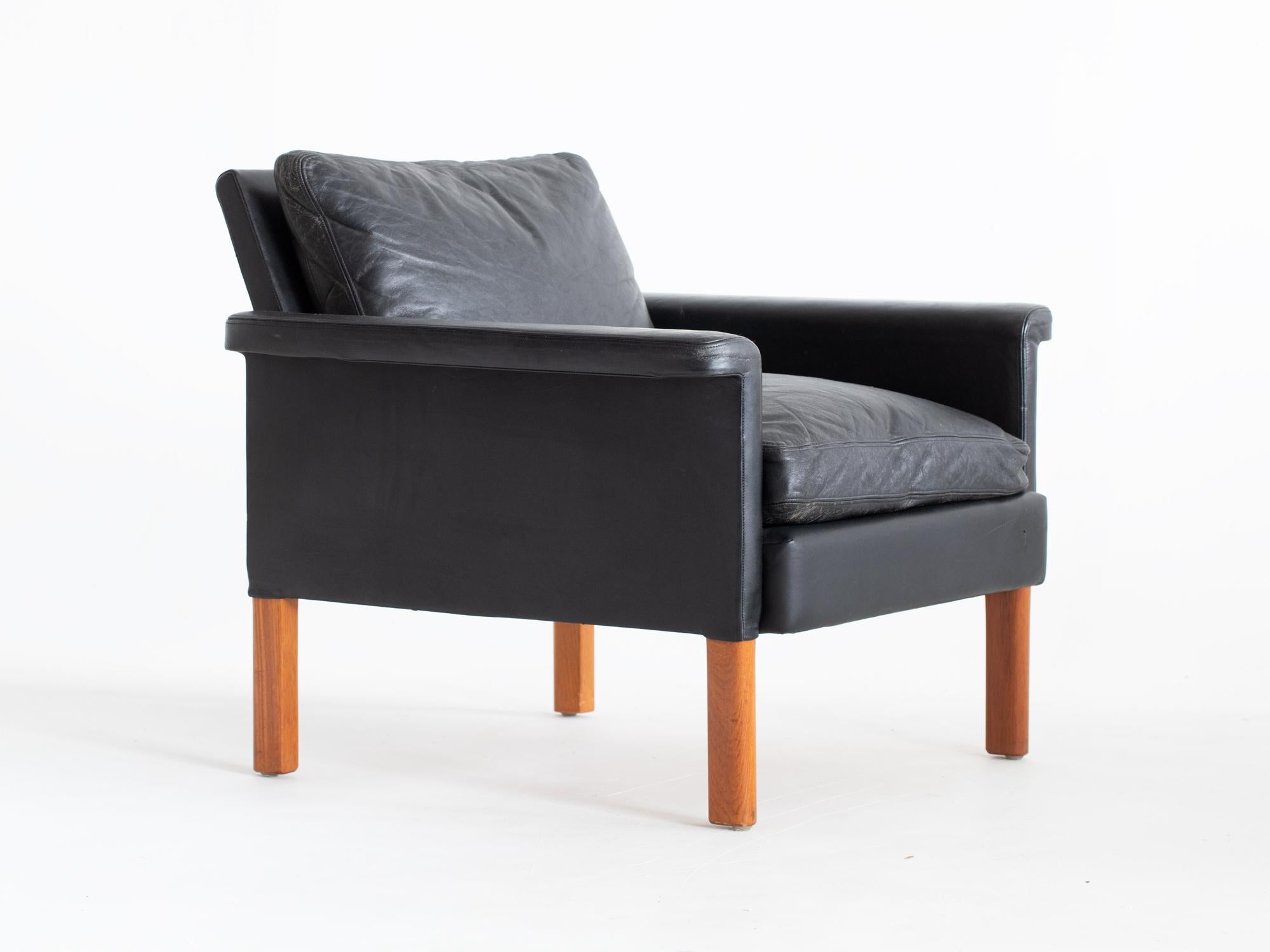 A mid-century leather armchair by Mio. Swedish, c. 1960s.

Sturdy beech frame. The original black leather upholstery is in good serviceable condition with very minor flaws.

69 x 77 x is 76 cm (27.2 x 30.3 x 29.9 
